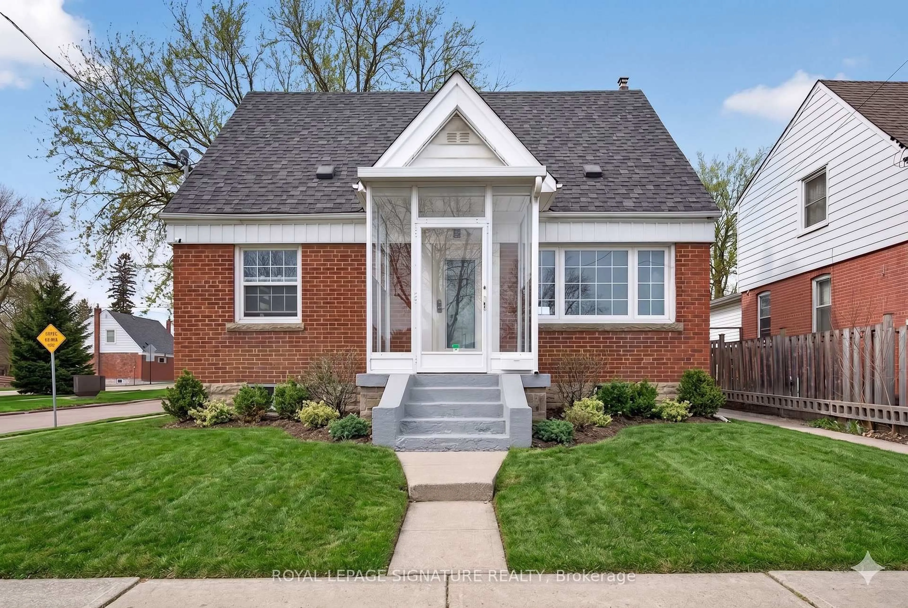 Home with brick exterior material, street for 3244 St Clair Ave, Toronto Ontario M1L 1V8