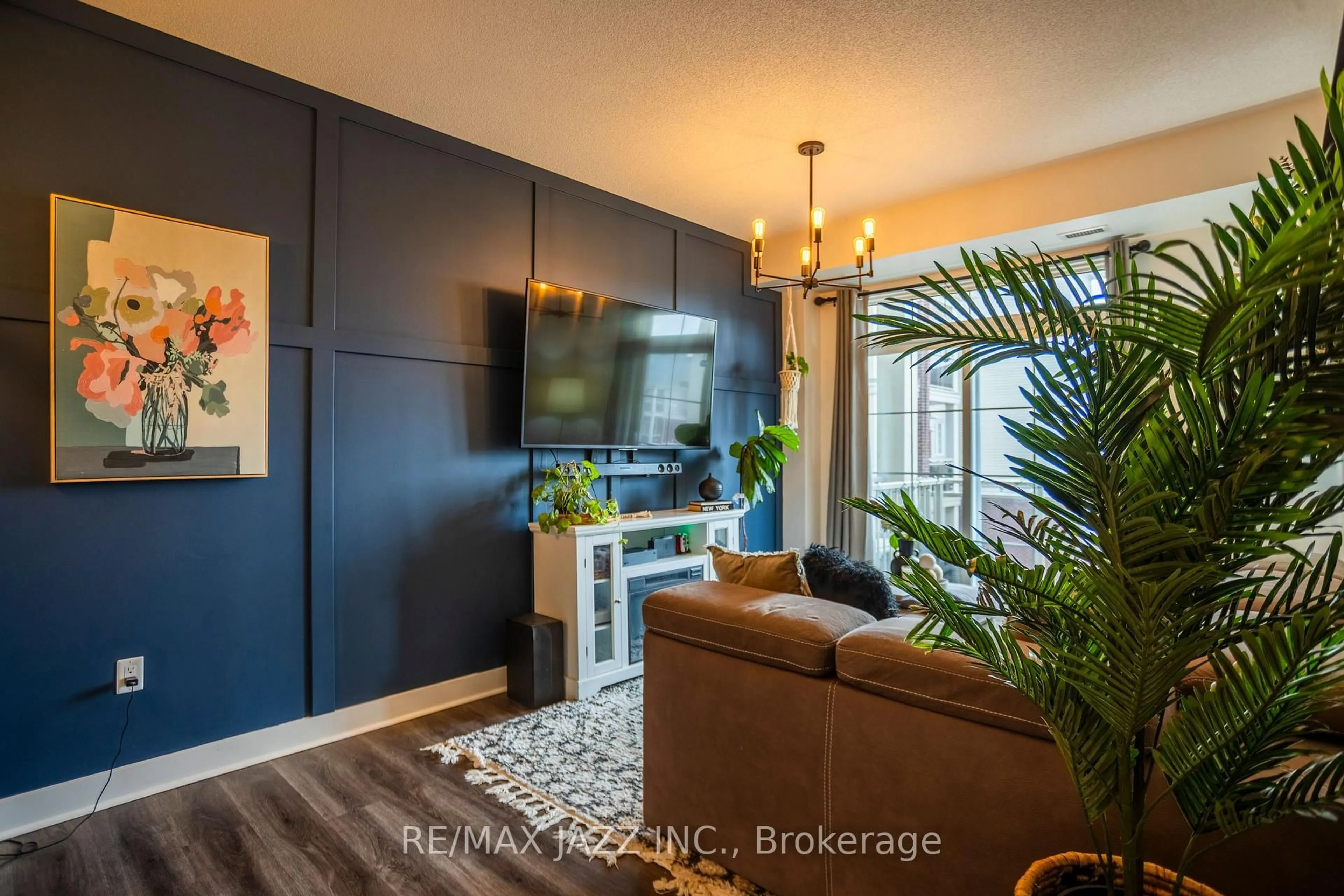 Living room with furniture, wood/laminate floor for 80 Aspen Springs Dr #308, Clarington Ontario L1C 0V4