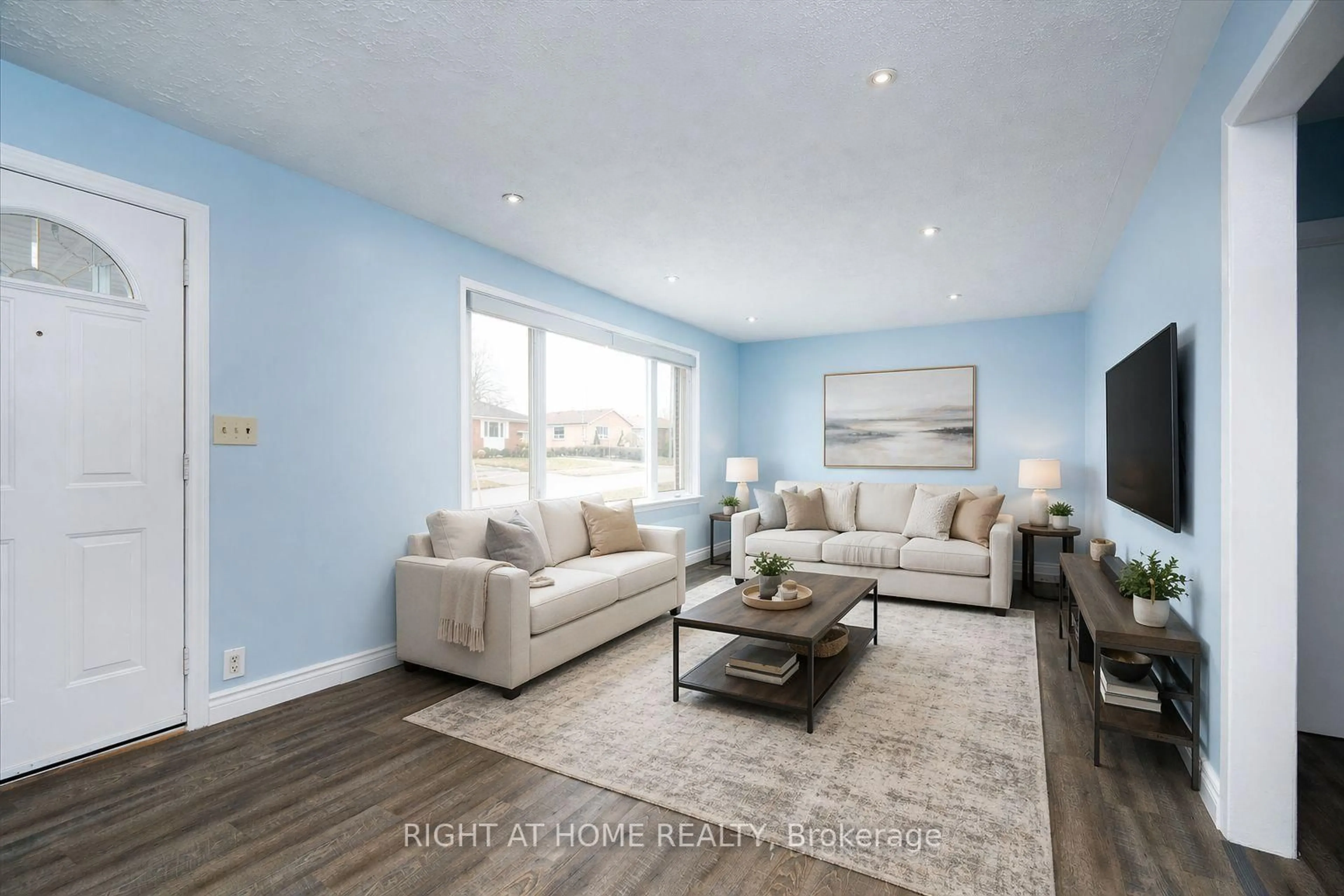Living room with furniture, wood/laminate floor for 322 Jasper Ave, Oshawa Ontario L1J 1L5