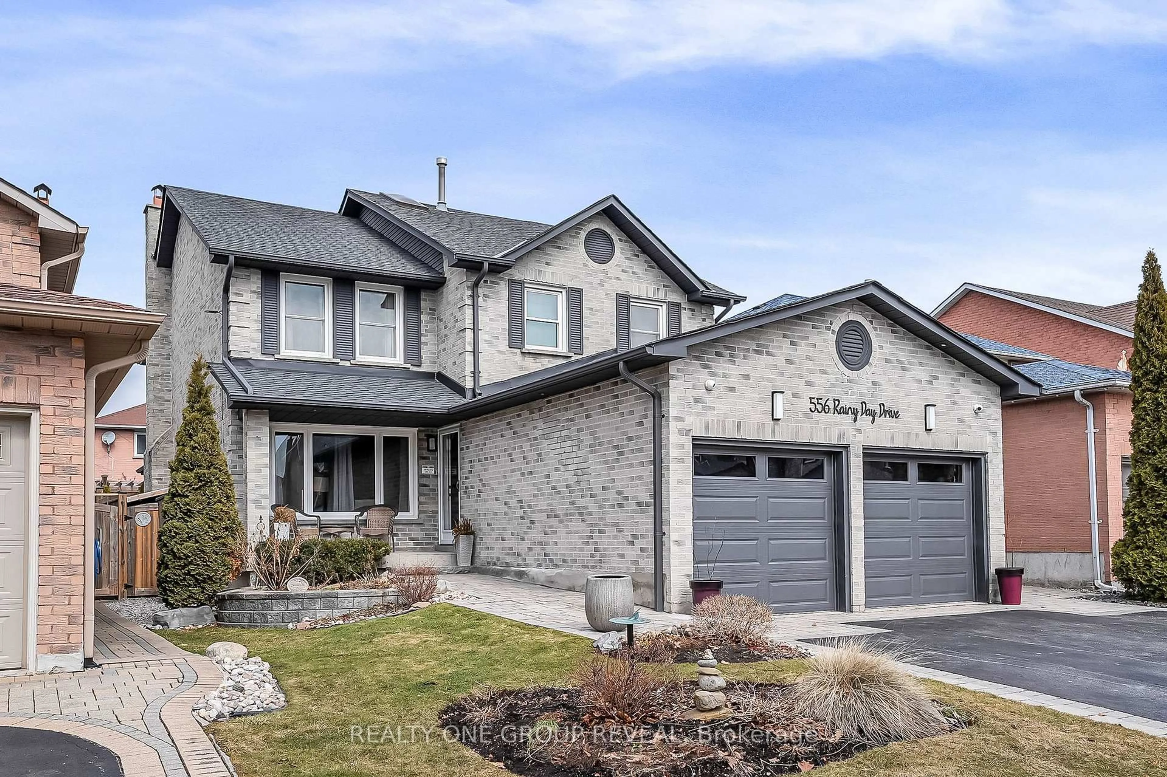 Home with brick exterior material, street for 556 Rainy Day Dr, Pickering Ontario L1V 5Z9