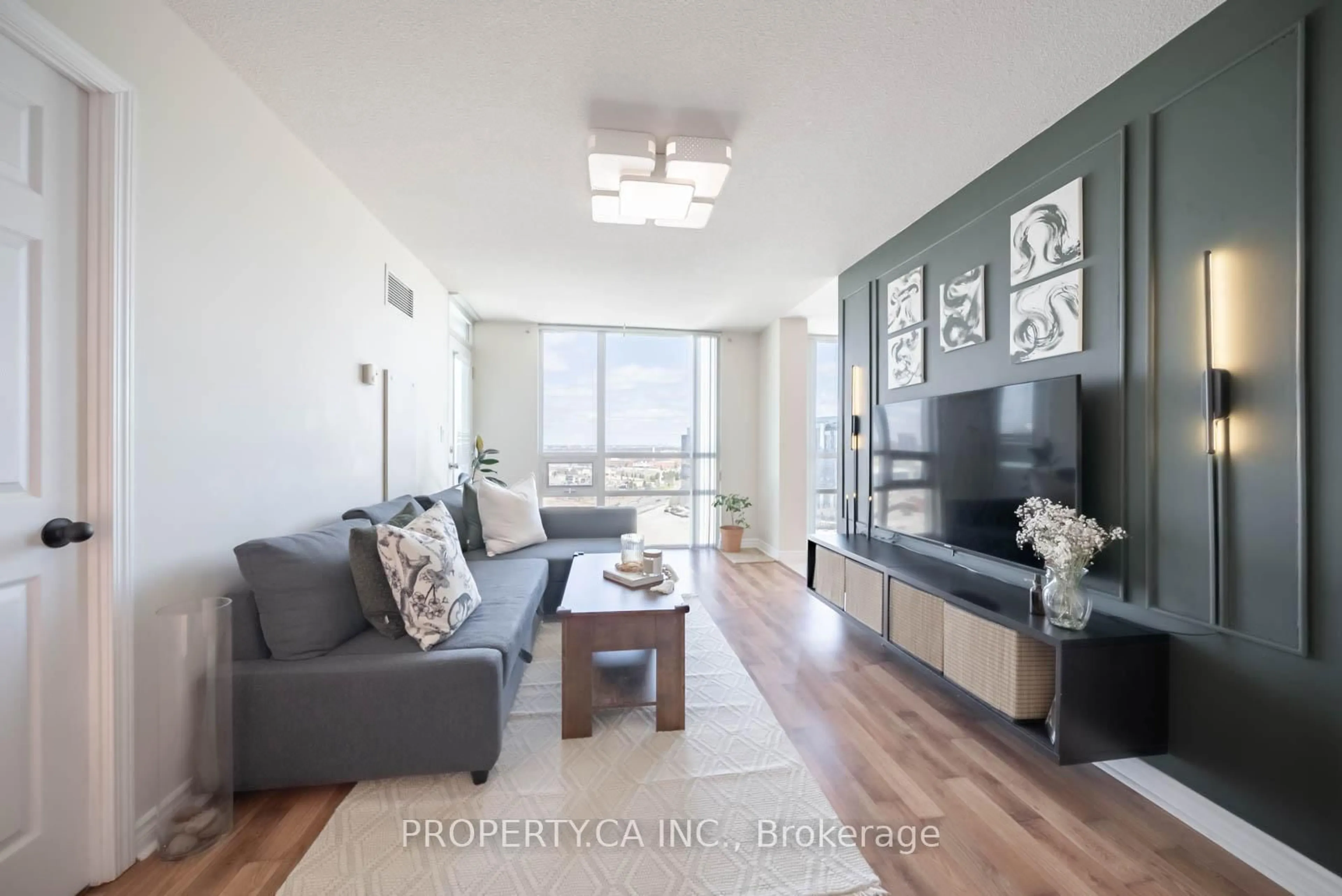 Living room with furniture, wood/laminate floor for 88 Grangeway Ave #2003, Toronto Ontario M1H 0A2