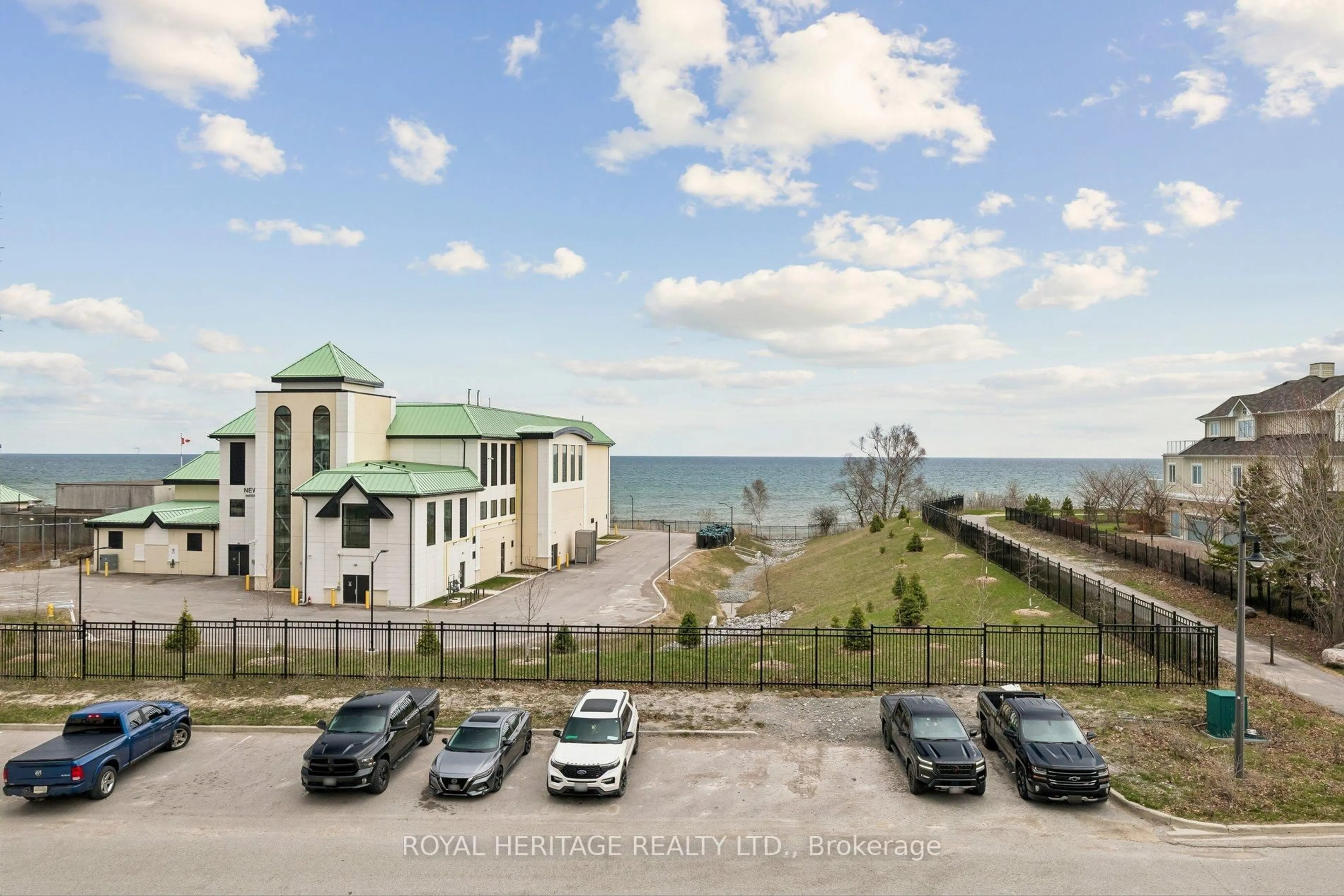 A pic from outside/outdoor area/front of a property/back of a property/a pic from drone, water/lake/river/ocean view for 50 Lakebreeze Dr #309, Clarington Ontario L1B 0V9