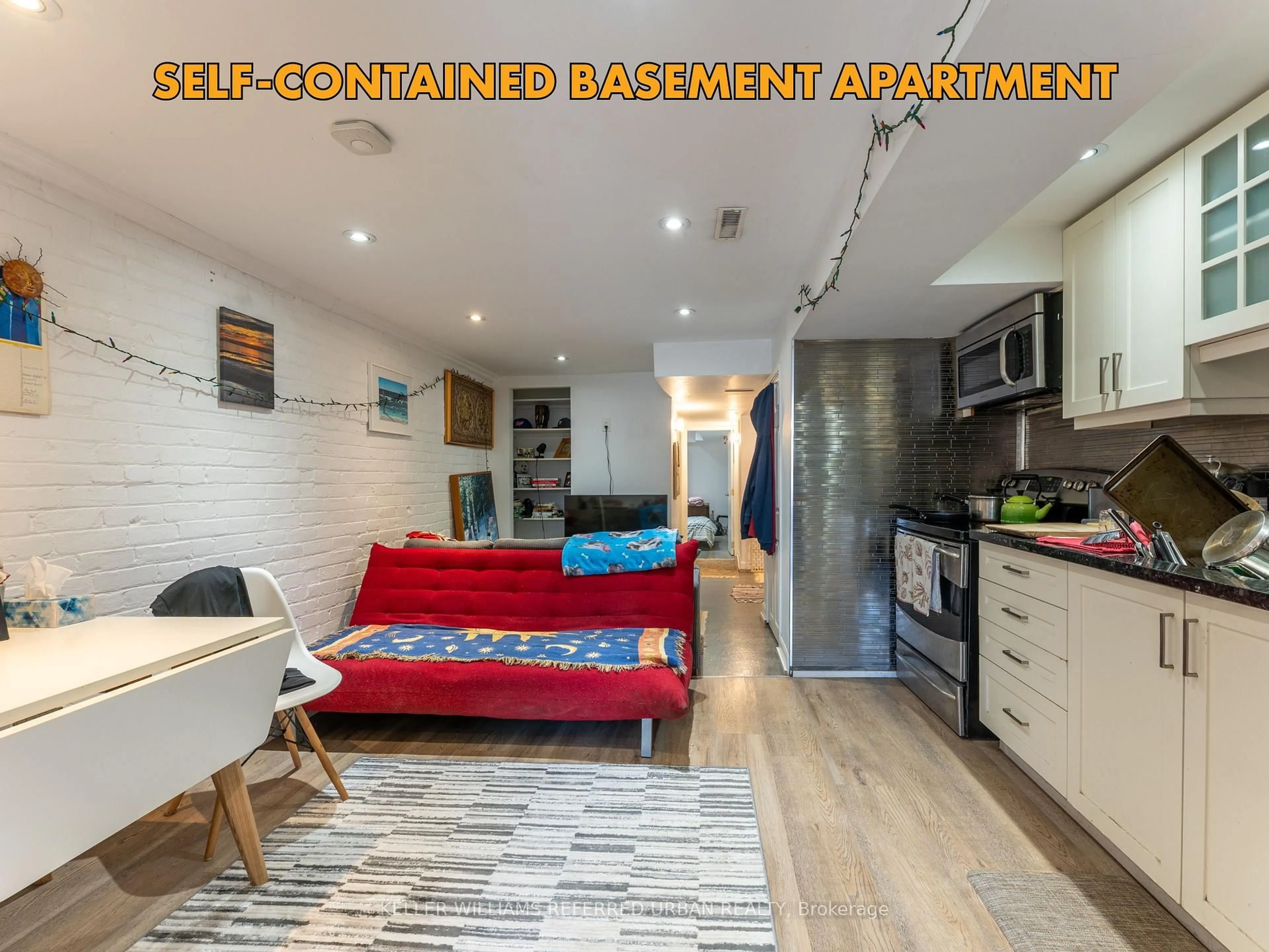 Open concept kitchen, wood/laminate floor for 522 Eastern Ave, Toronto Ontario M4M 1C7