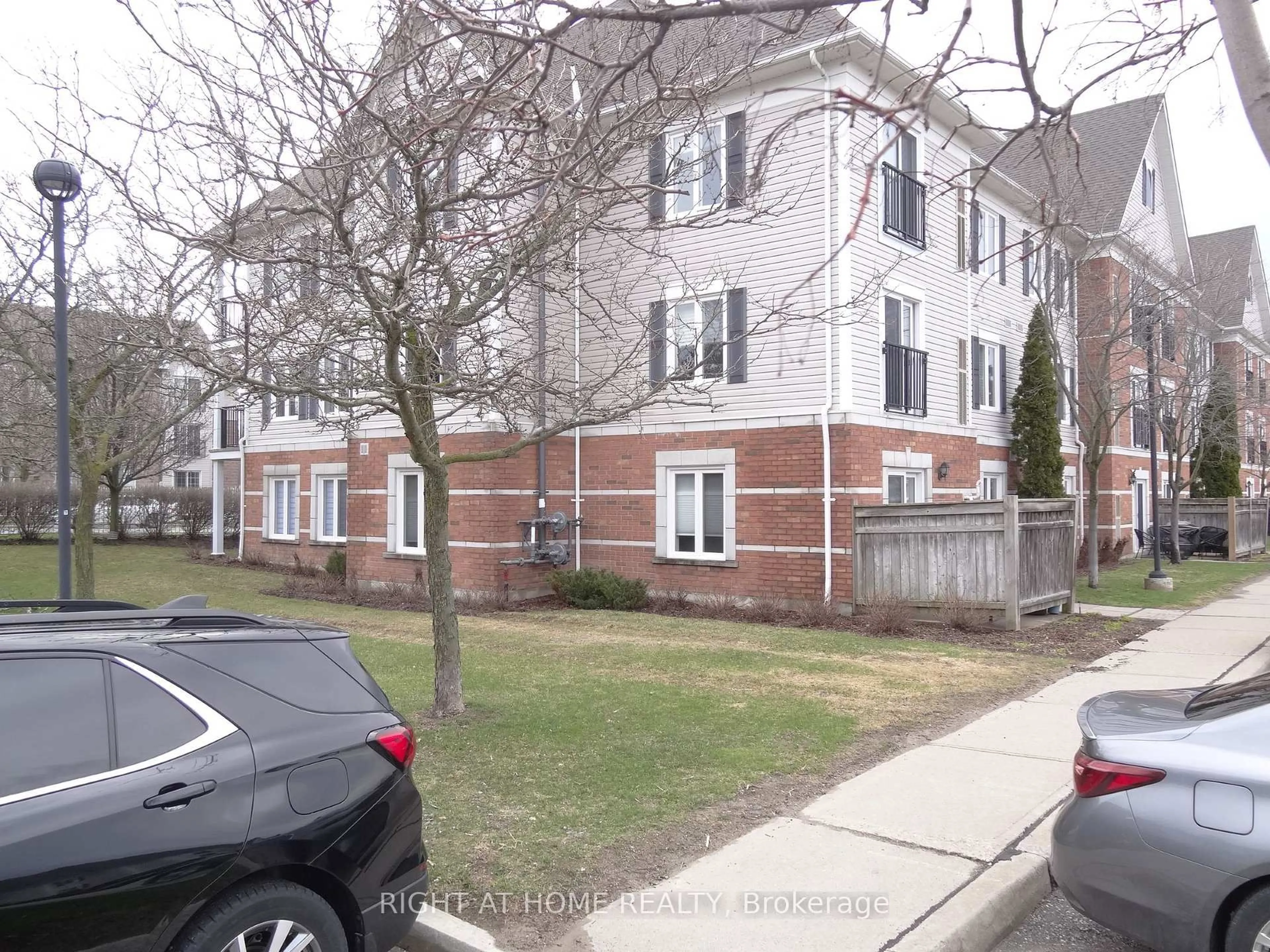 A pic from outside/outdoor area/front of a property/back of a property/a pic from drone, street for 102 Aspen Springs Dr #106, Clarington Ontario L1C 5N6