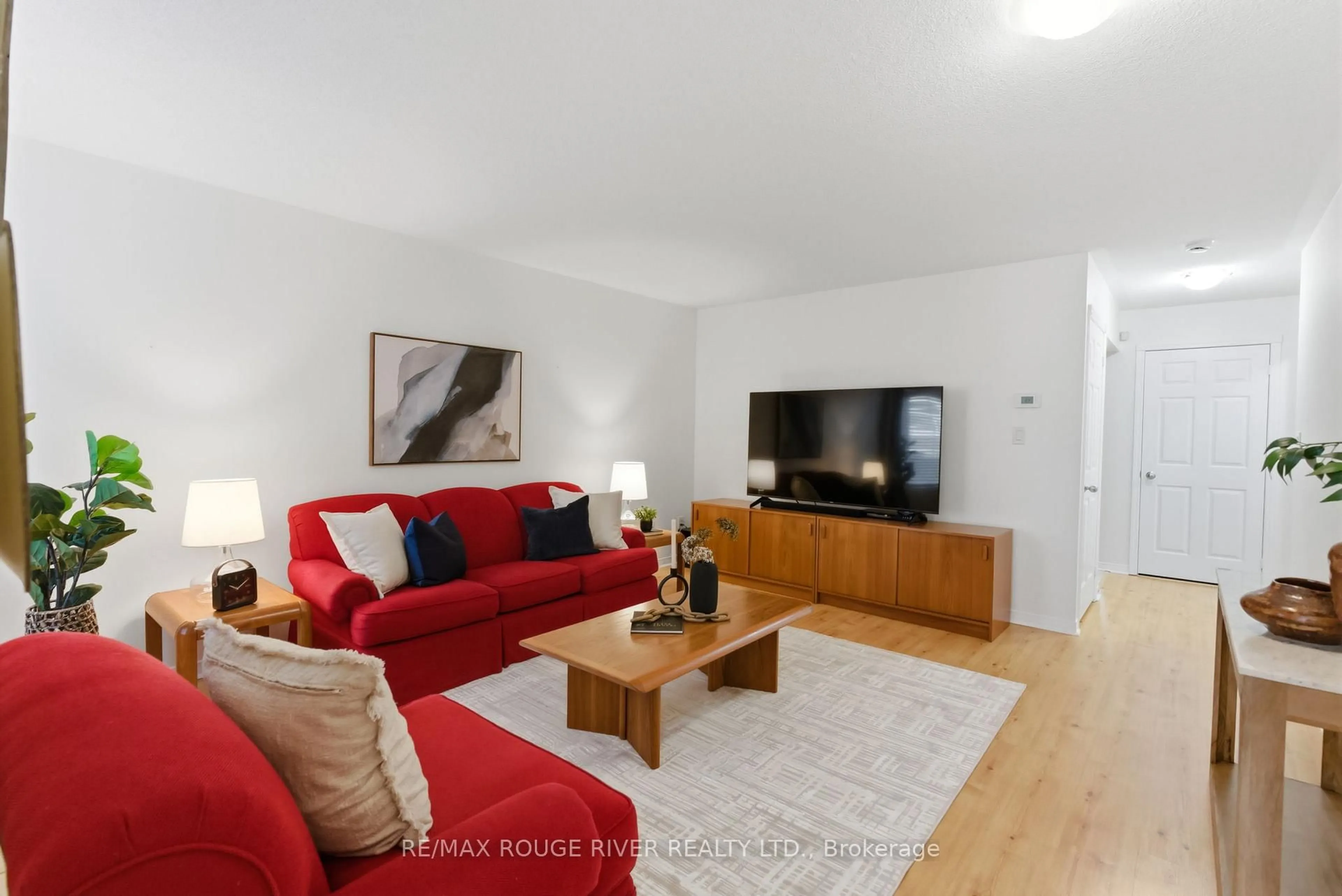 Living room with furniture, wood/laminate floor for 1154 Meath Dr, Oshawa Ontario L1K 0G3