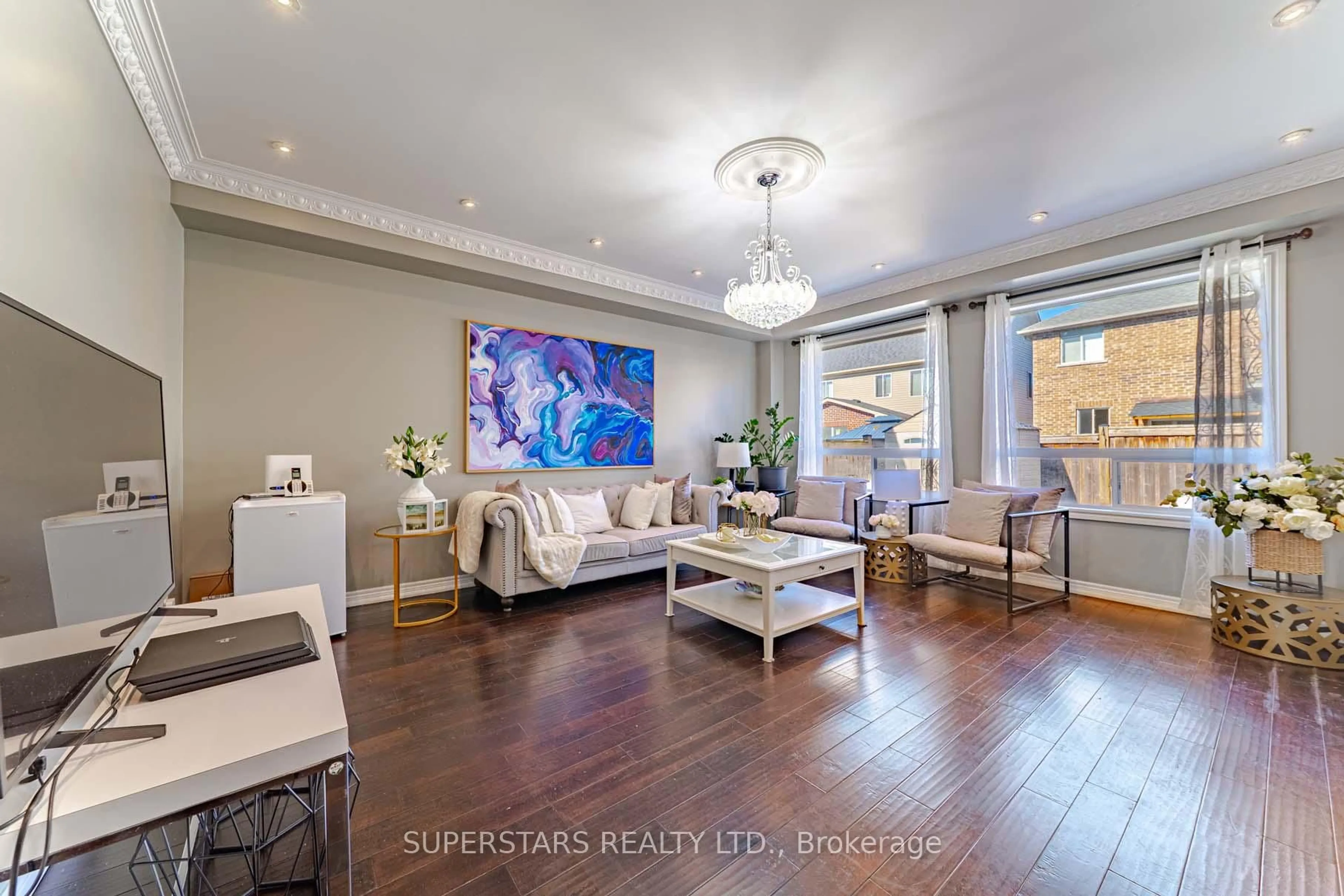 Living room with furniture, wood/laminate floor for 2410 Bridle Rd, Oshawa Ontario L1L 0E1