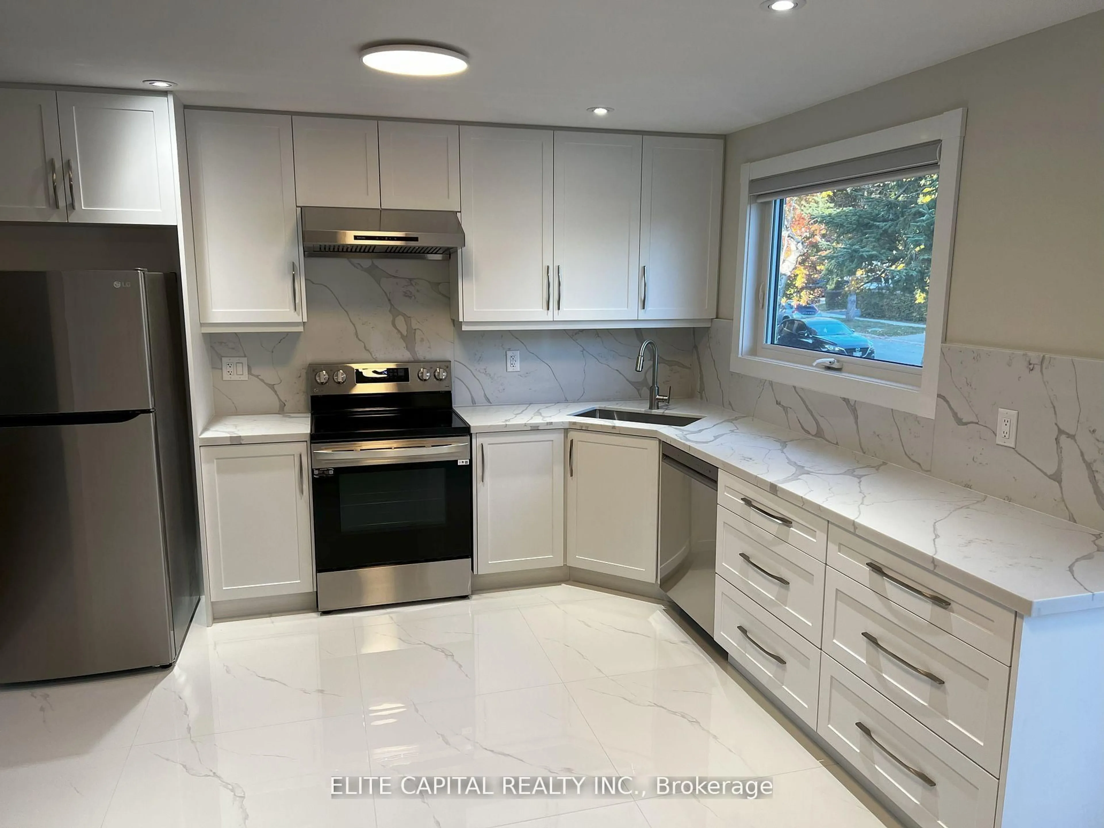 Open concept kitchen, ceramic/tile floor for 69 Hutcherson Sq, Toronto Ontario M1B 1C5