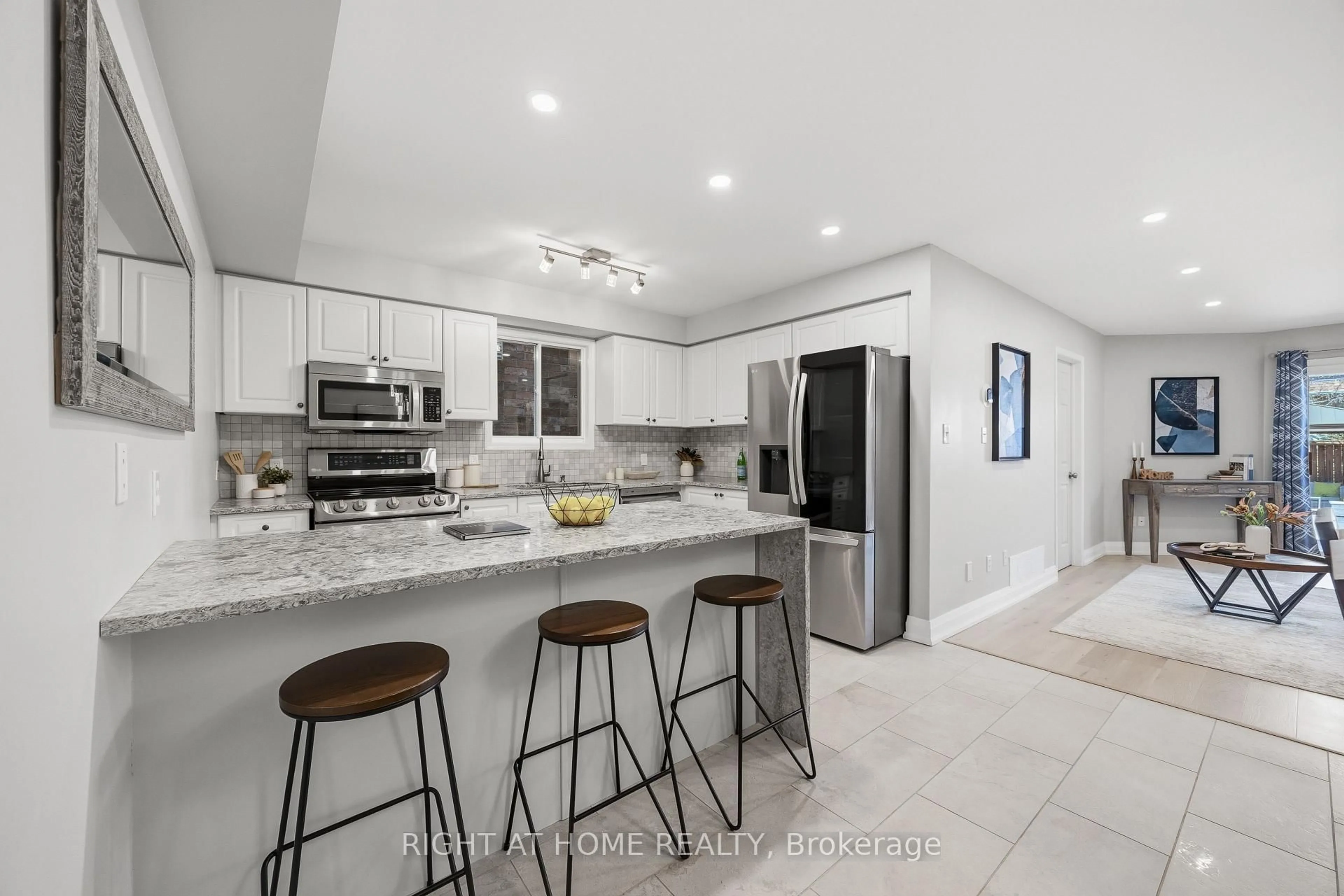 Open concept kitchen, ceramic/tile floor for 490 Flagstone Crt, Oshawa Ontario L1K 2Z7