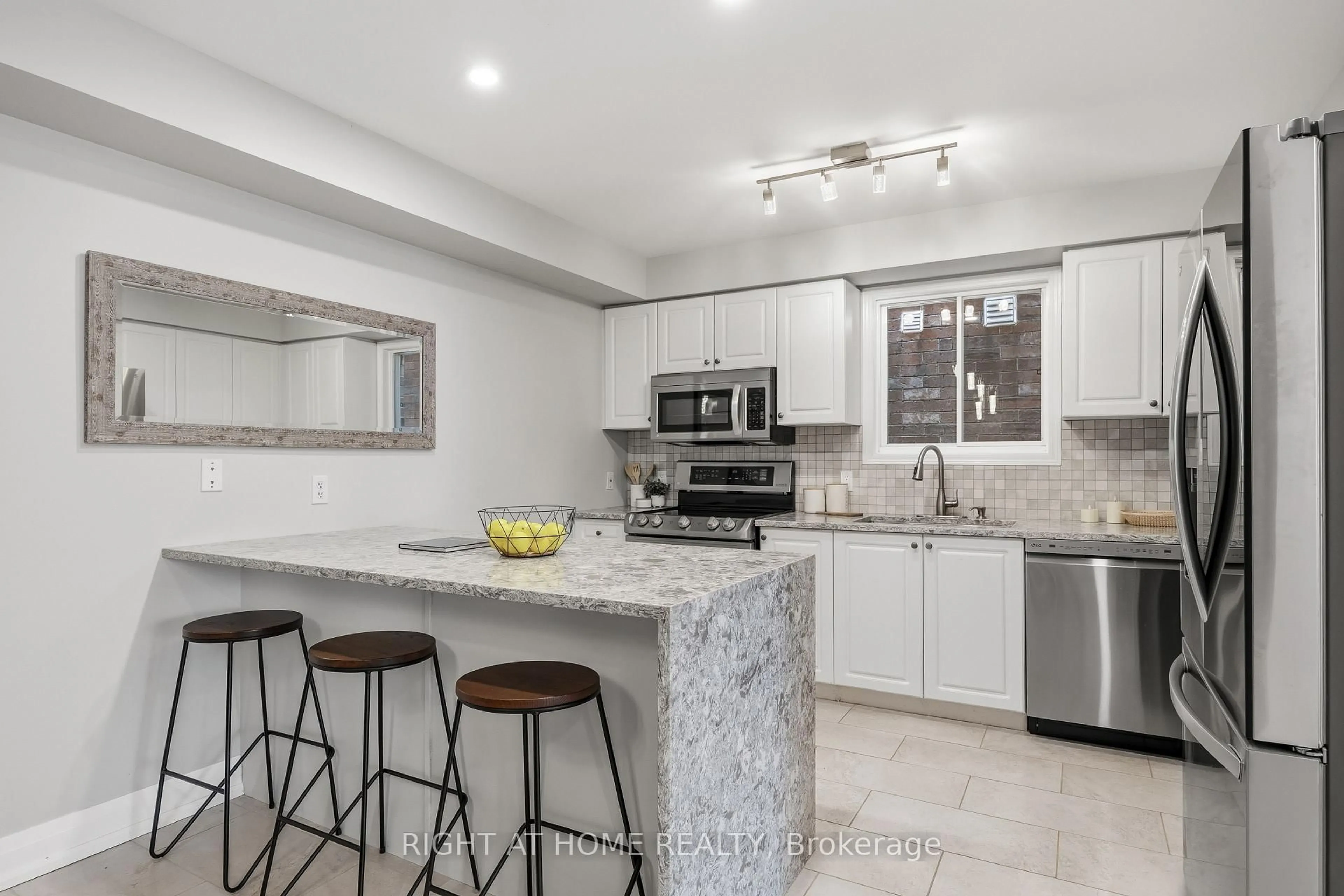 Open concept kitchen, ceramic/tile floor for 490 Flagstone Crt, Oshawa Ontario L1K 2Z7