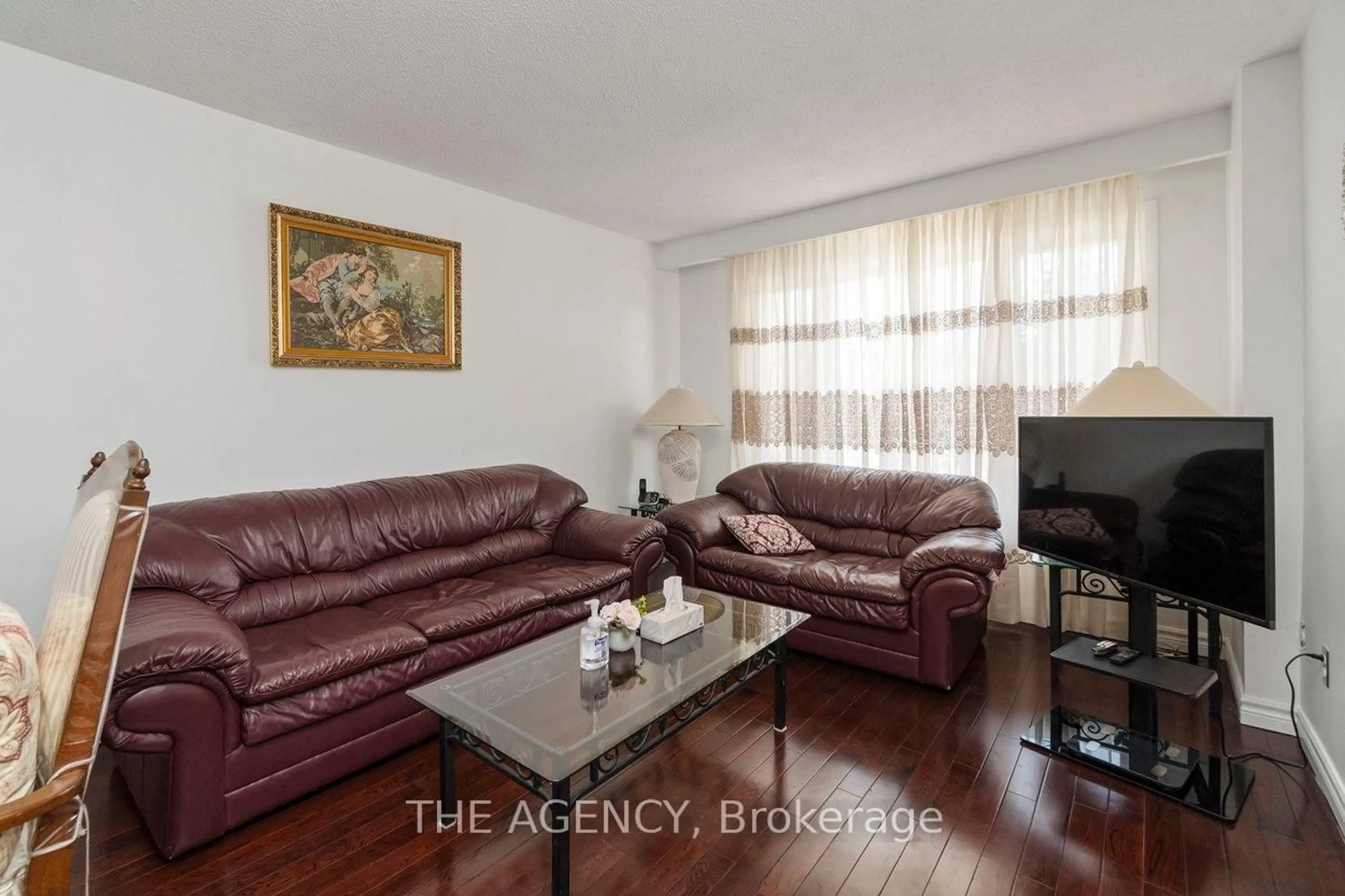 Living room with furniture, wood/laminate floor for 402 Kingston Rd, Toronto Ontario M4L 1T9