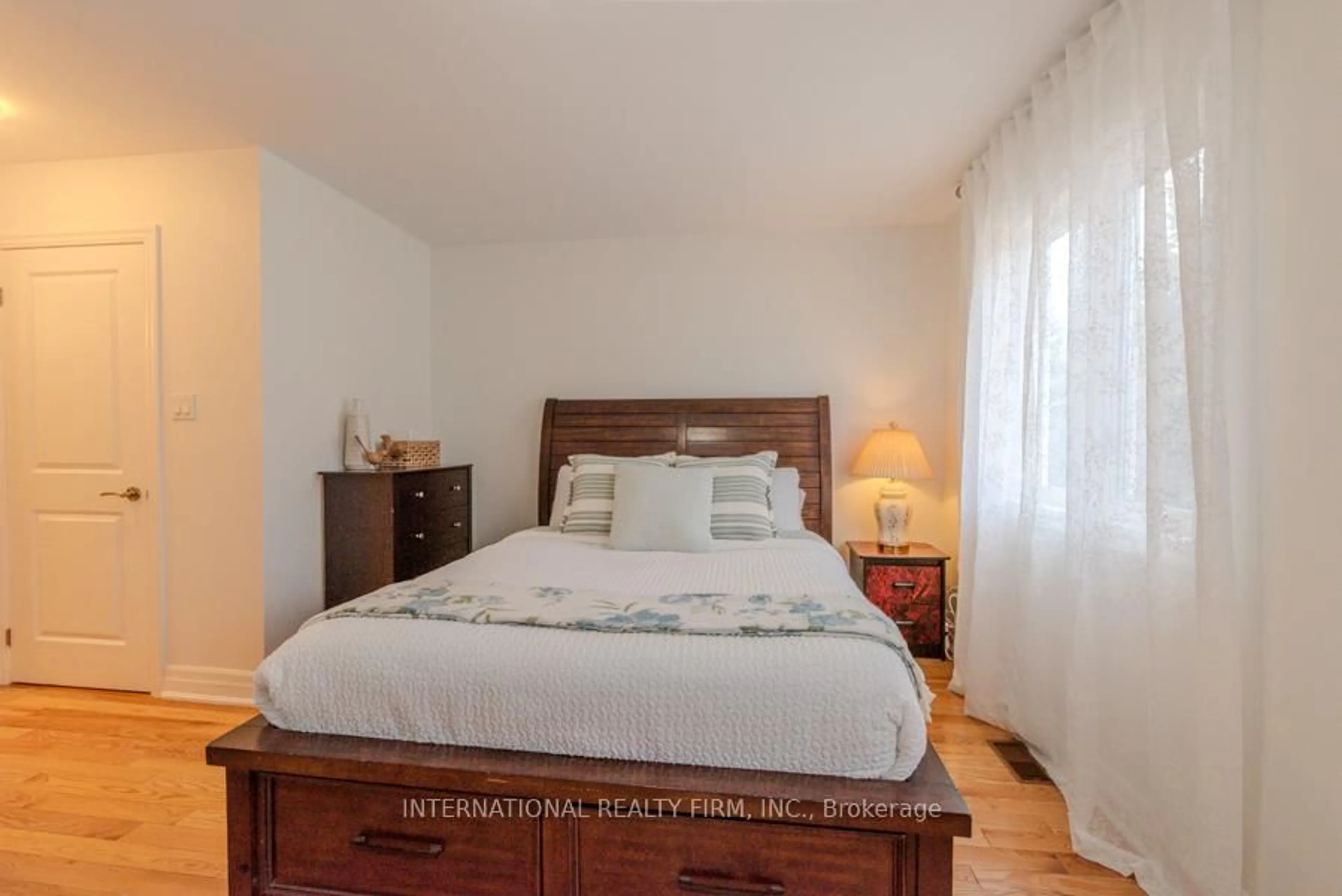 Bedroom with bed, wood/laminate floor for 28 Camps Lane, Toronto Ontario M1E 0B2