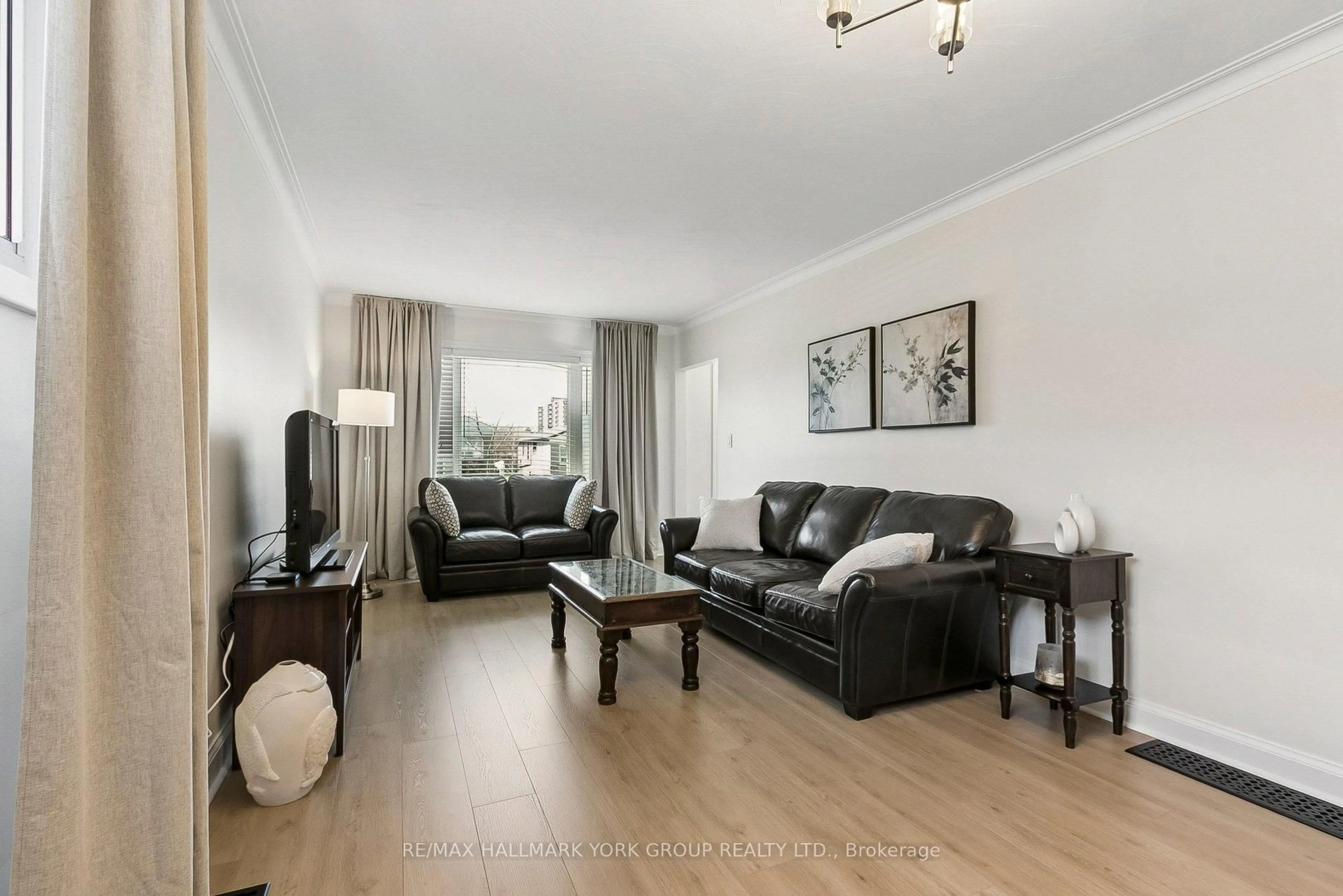 Living room with furniture, wood/laminate floor for 5 Larmere Crt, Toronto Ontario M1K 1V8