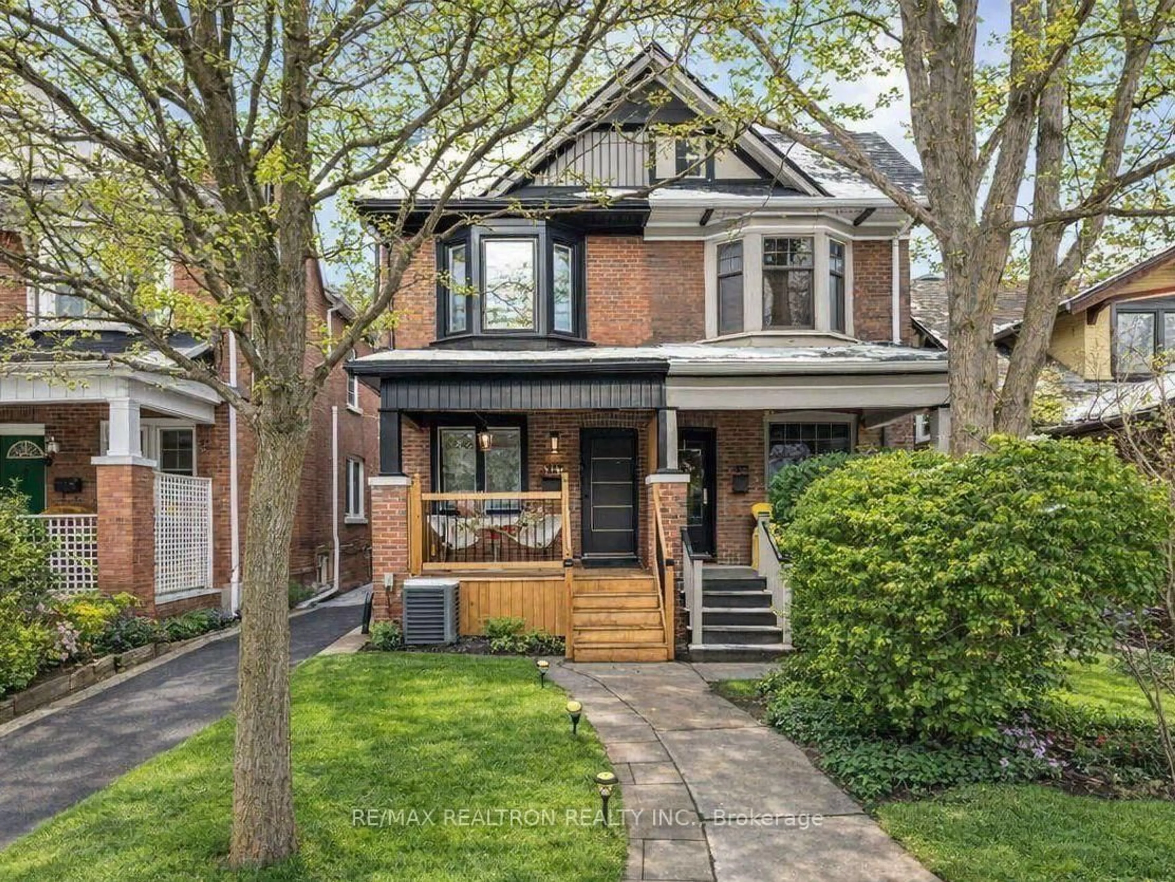 Home with brick exterior material, street for 111 Glenmore Rd, Toronto Ontario M4L 3M2