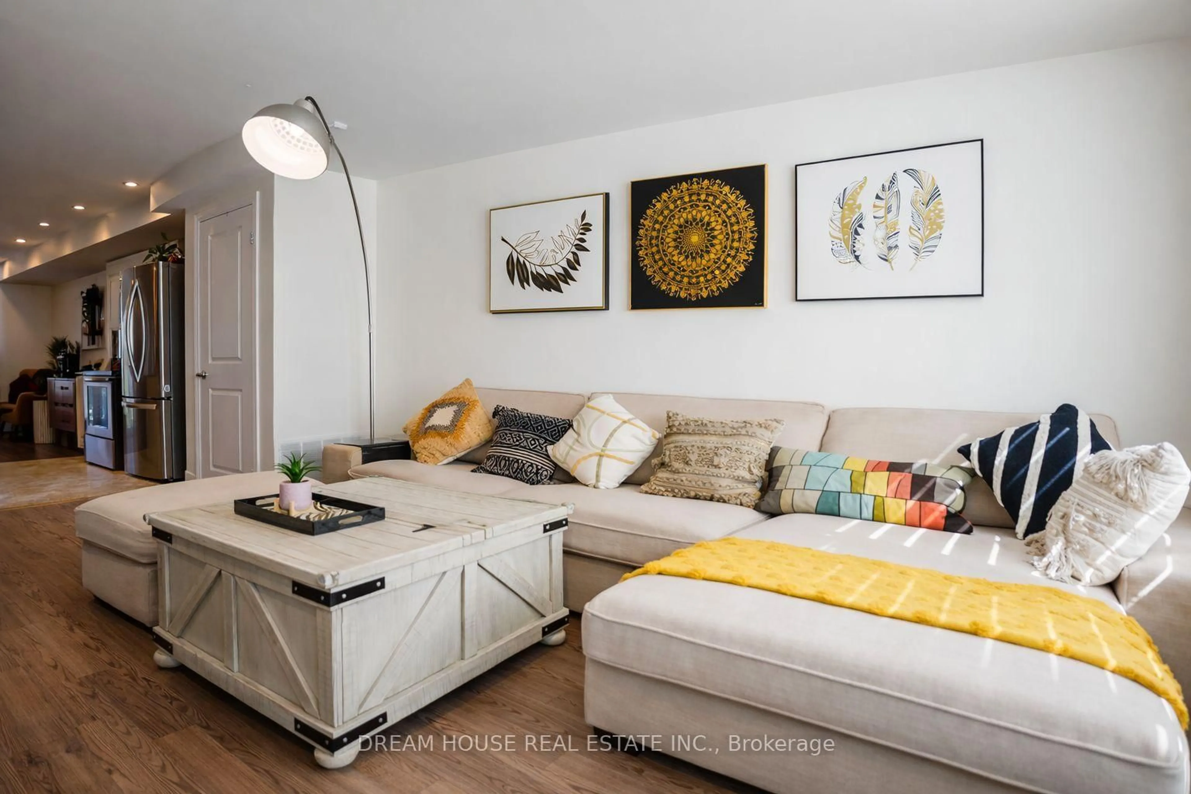 Living room with furniture, wood/laminate floor for 2500 Hill Rise Crt #94, Oshawa Ontario L1L 0M6