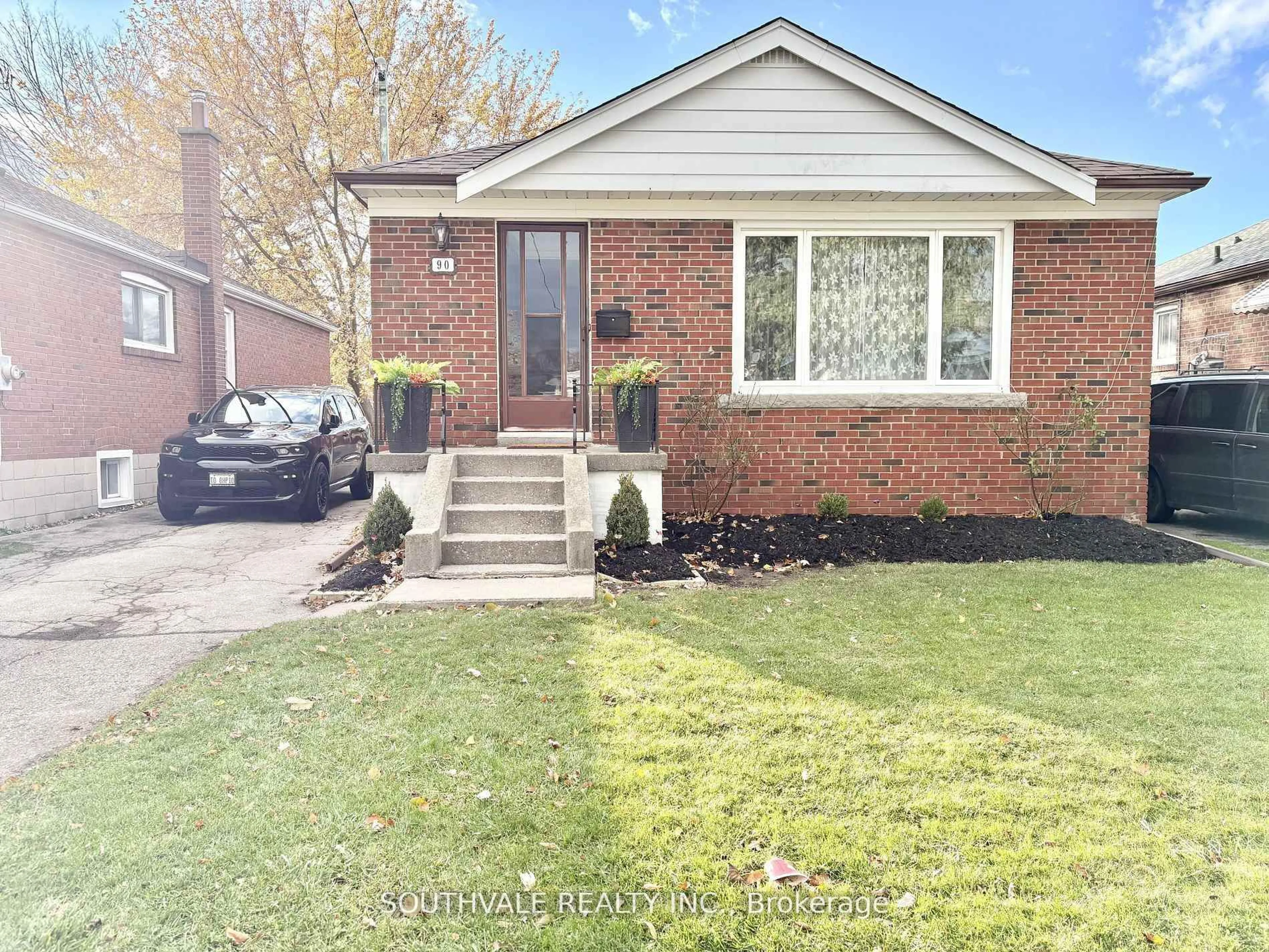 Home with brick exterior material, street for 90 Trinnell Blvd, Toronto Ontario M1L 1S7