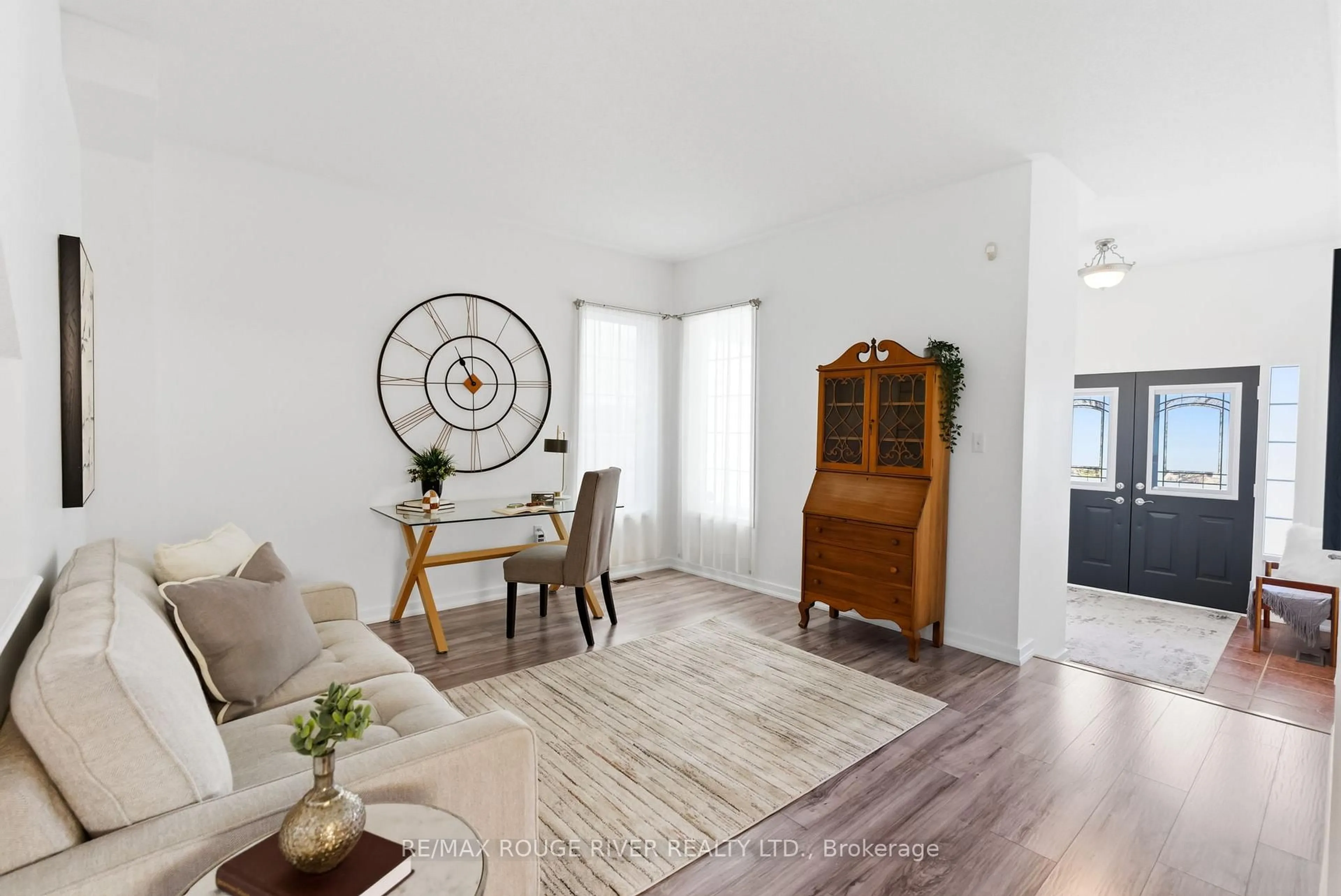 Living room with furniture, wood/laminate floor for 1086 Songbird Dr, Oshawa Ontario L1K 2Y9