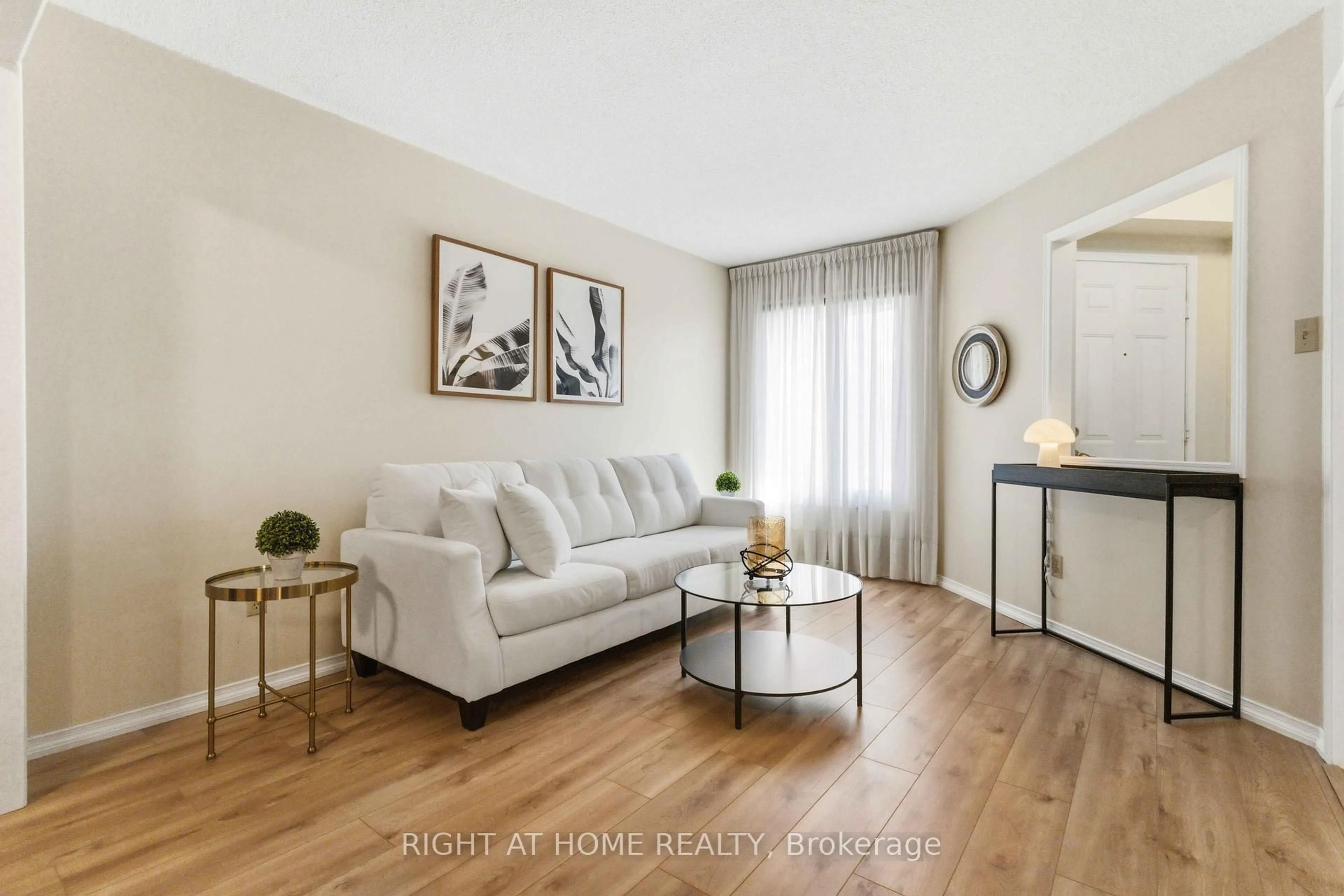 Living room with furniture, wood/laminate floor for 39 Davies Cres, Whitby Ontario L1N 8X4