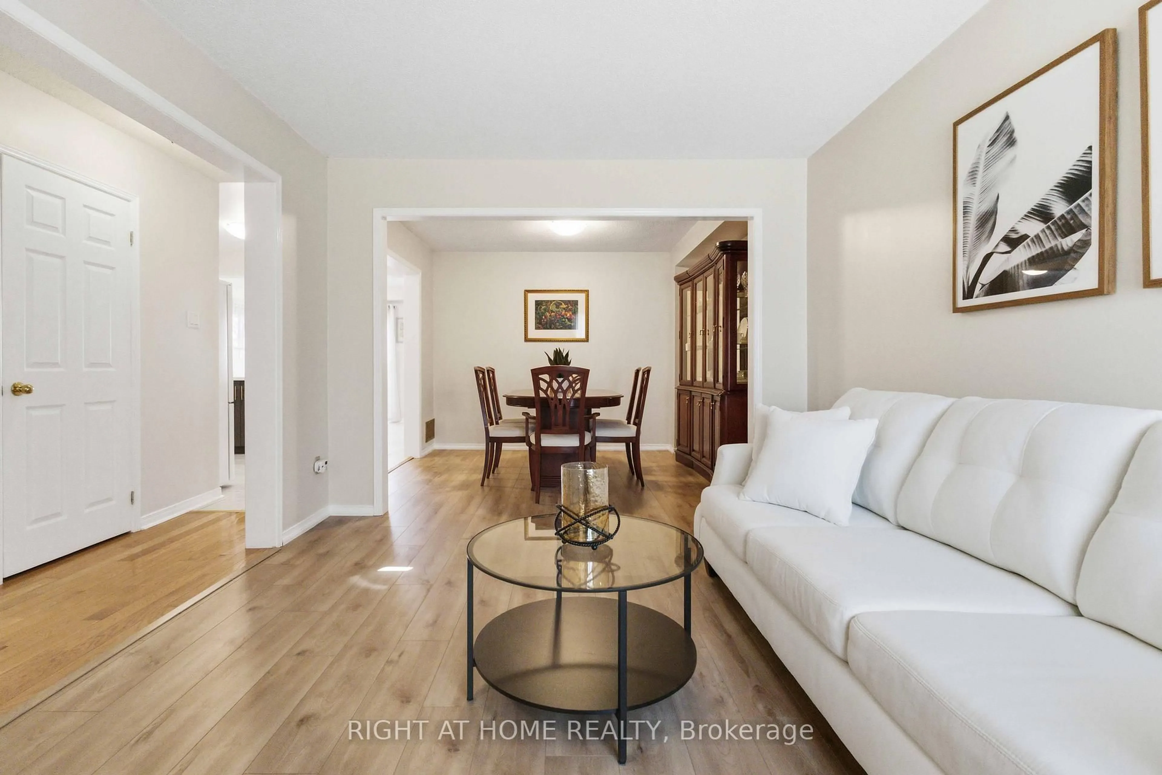 Living room with furniture, wood/laminate floor for 39 Davies Cres, Whitby Ontario L1N 8X4