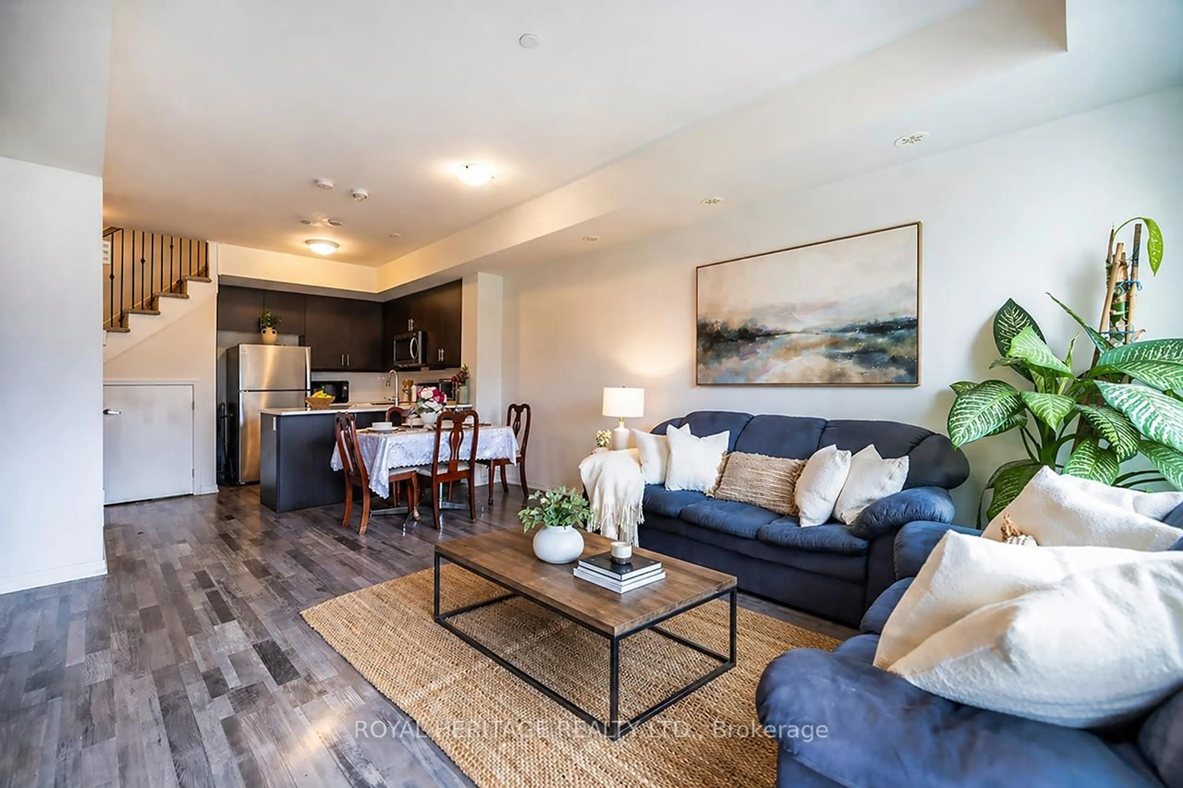 Living room with furniture, wood/laminate floor for 1460 Whites Rd #413, Pickering Ontario L1V 0E8