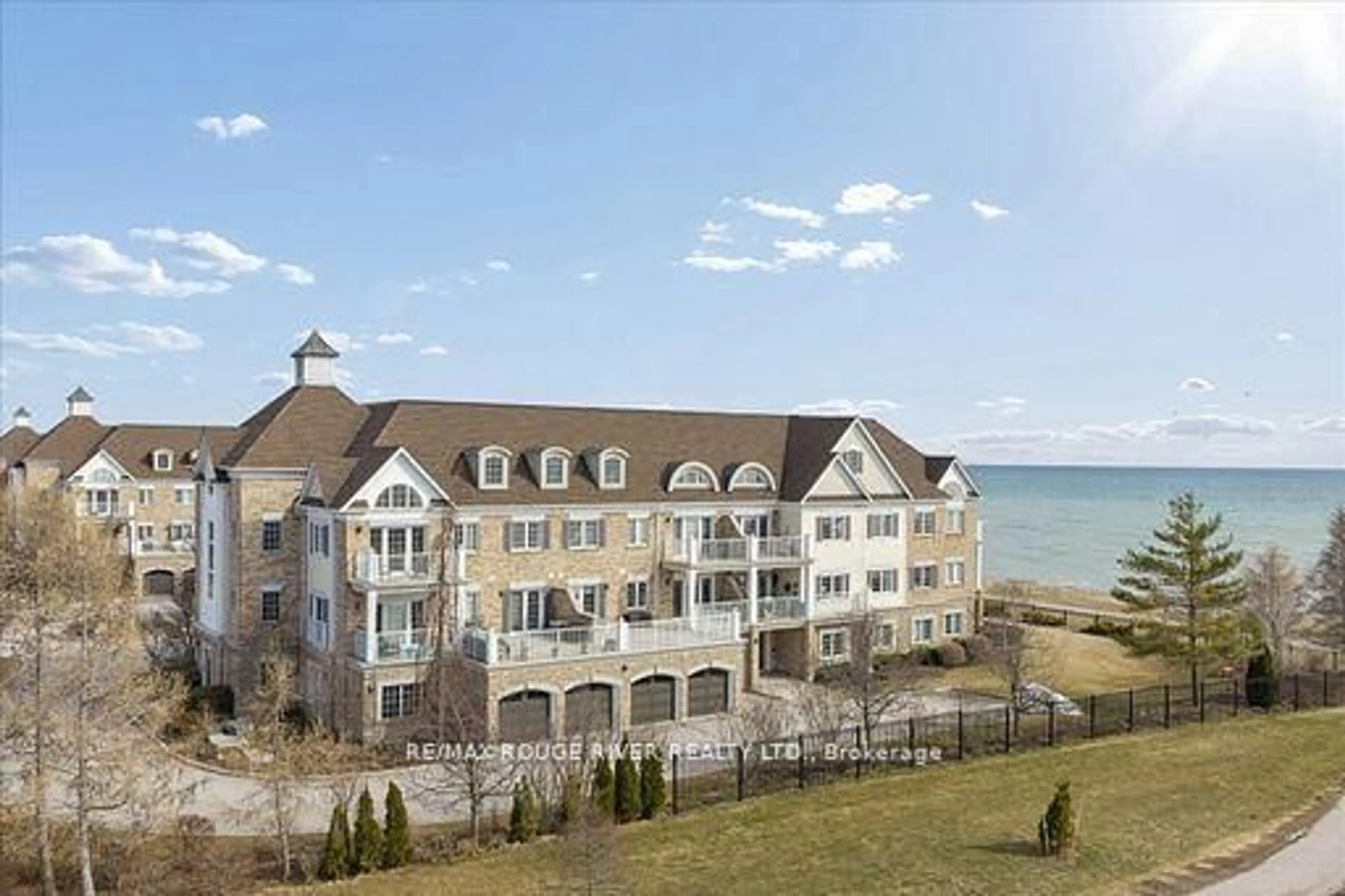 A pic from outside/outdoor area/front of a property/back of a property/a pic from drone, water/lake/river/ocean view for 395 Lakebreeze Dr #306, Clarington Ontario L1B 0A5