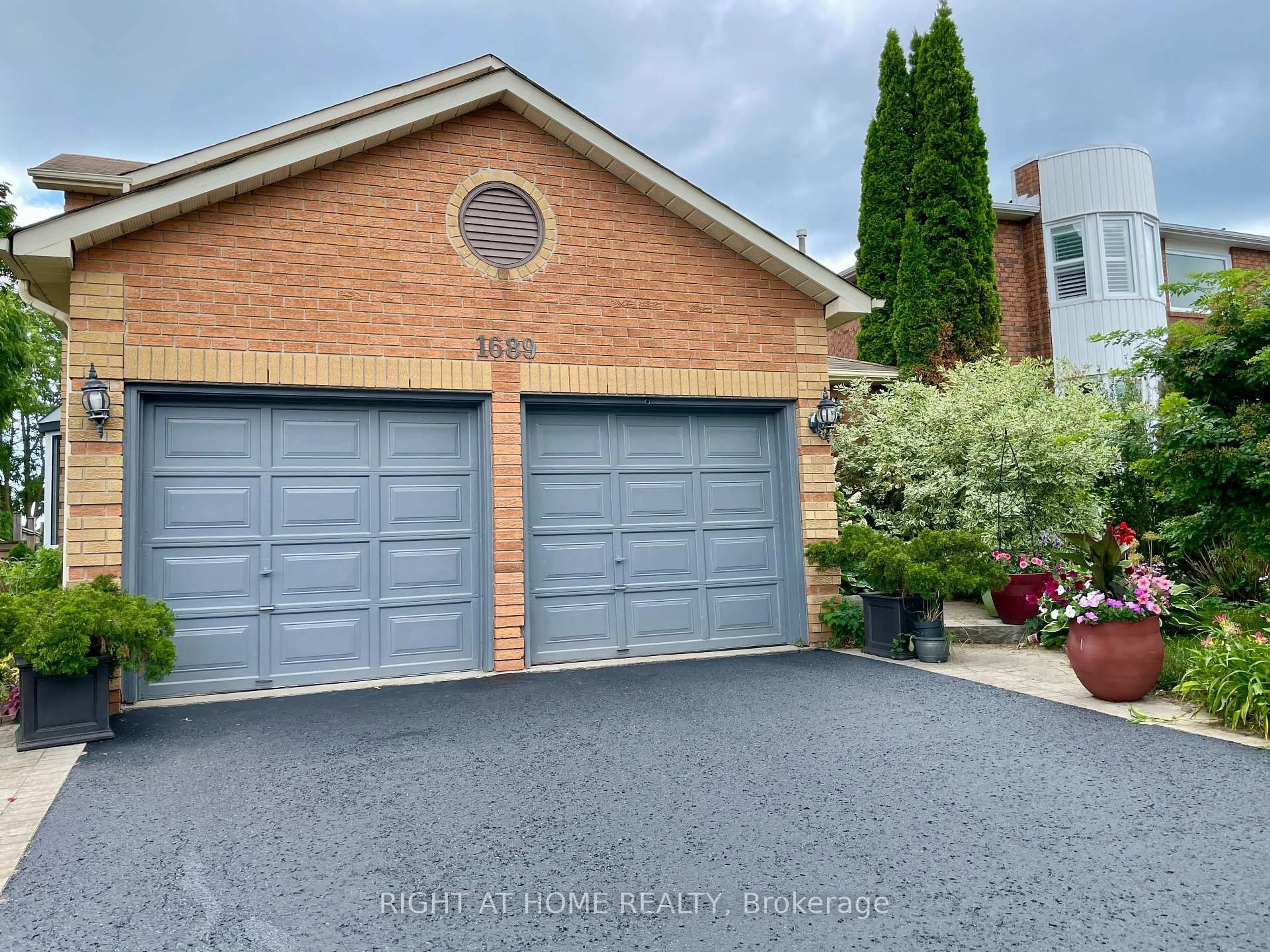 Home with brick exterior material, street for 1689 Major Oaks Rd, Pickering Ontario L1X 1X1