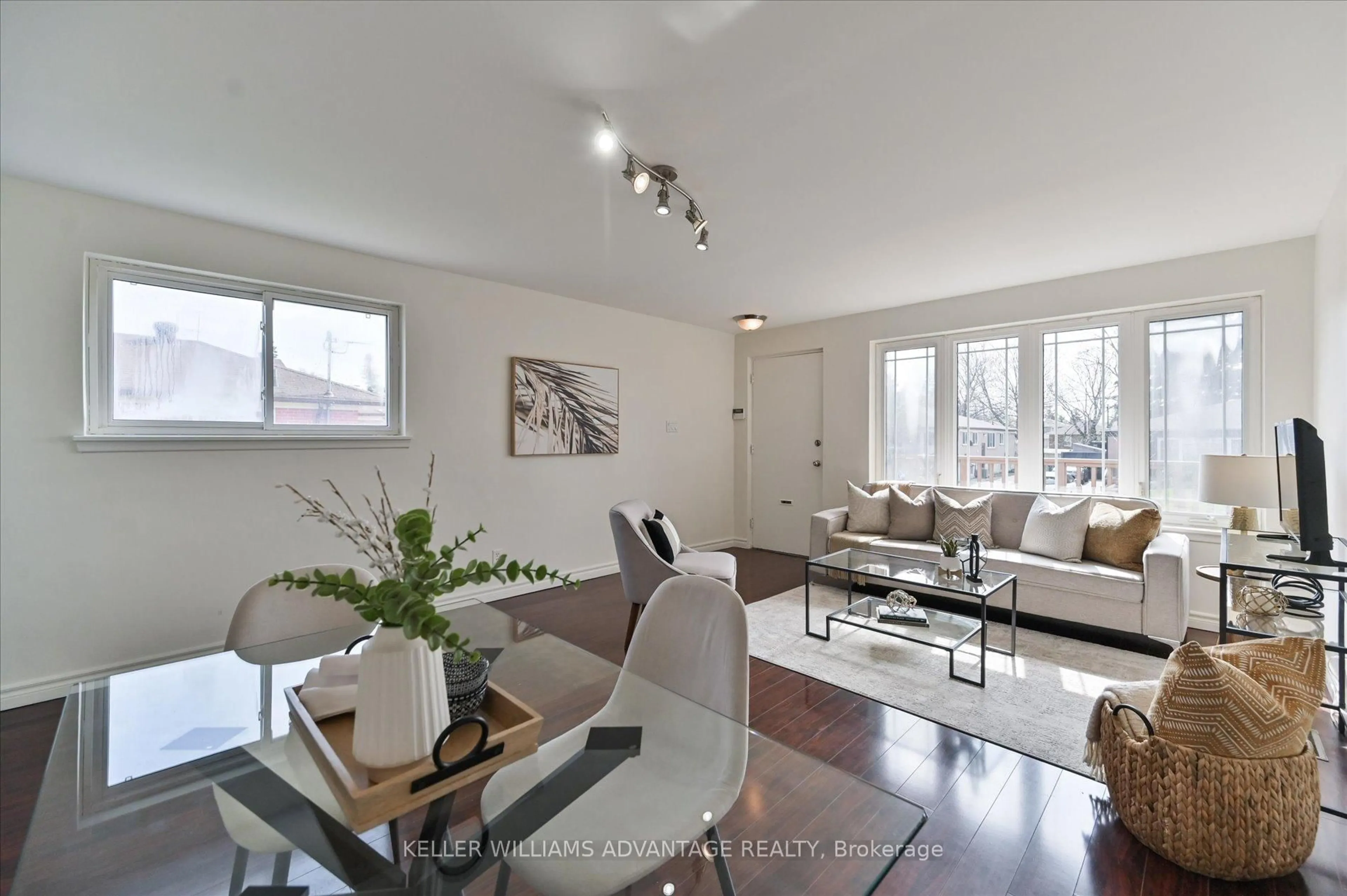 Living room with furniture, wood/laminate floor for 201 Linden Ave, Toronto Ontario M1K 3J1