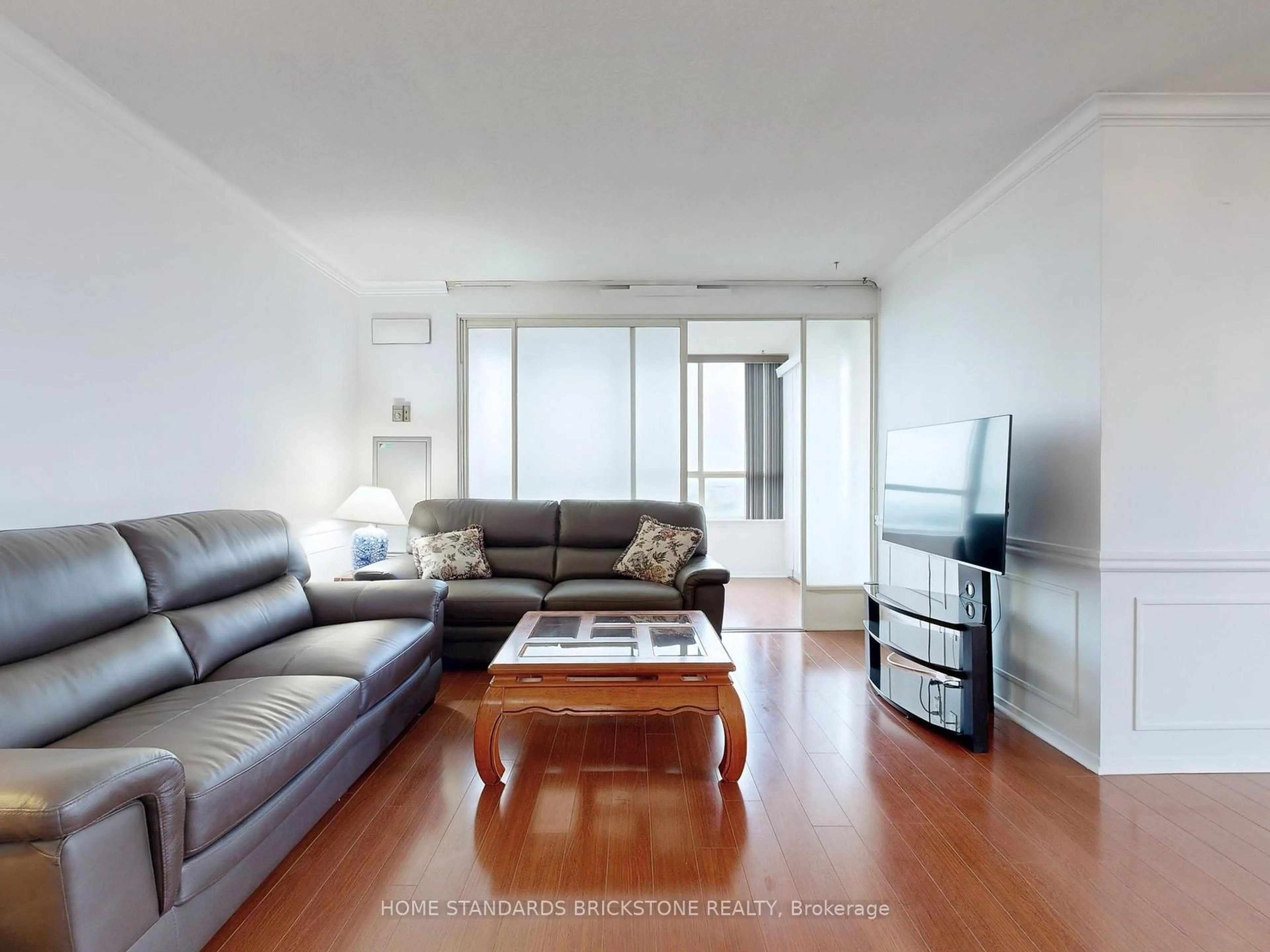 Living room with furniture, wood/laminate floor for 30 Thunder Grve #1705, Toronto Ontario M1V 4A3