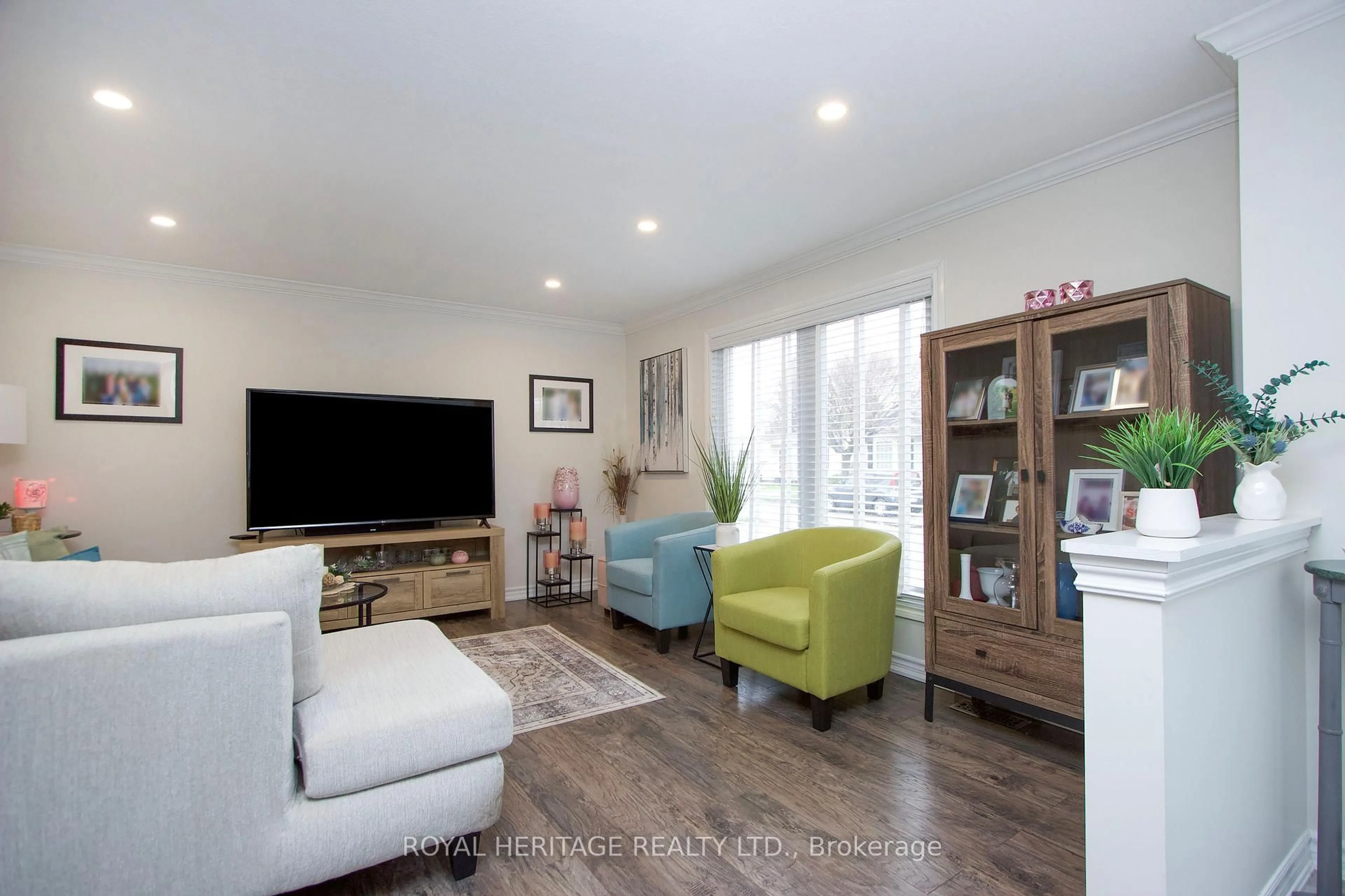 Living room with furniture, wood/laminate floor for 209 Wilmot Tr, Clarington Ontario L1B 1A9