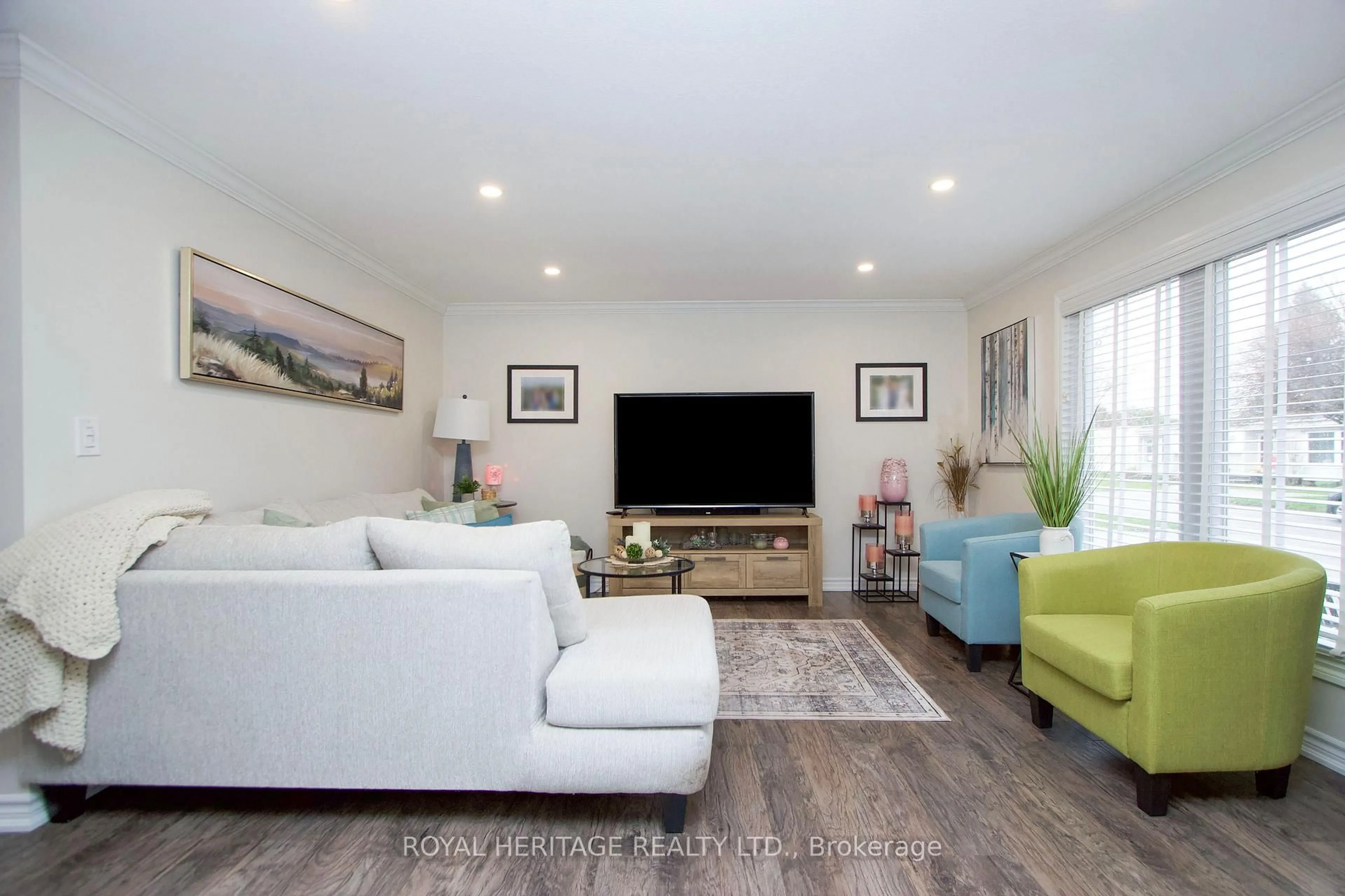 Living room with furniture, wood/laminate floor for 209 Wilmot Tr, Clarington Ontario L1B 1A9