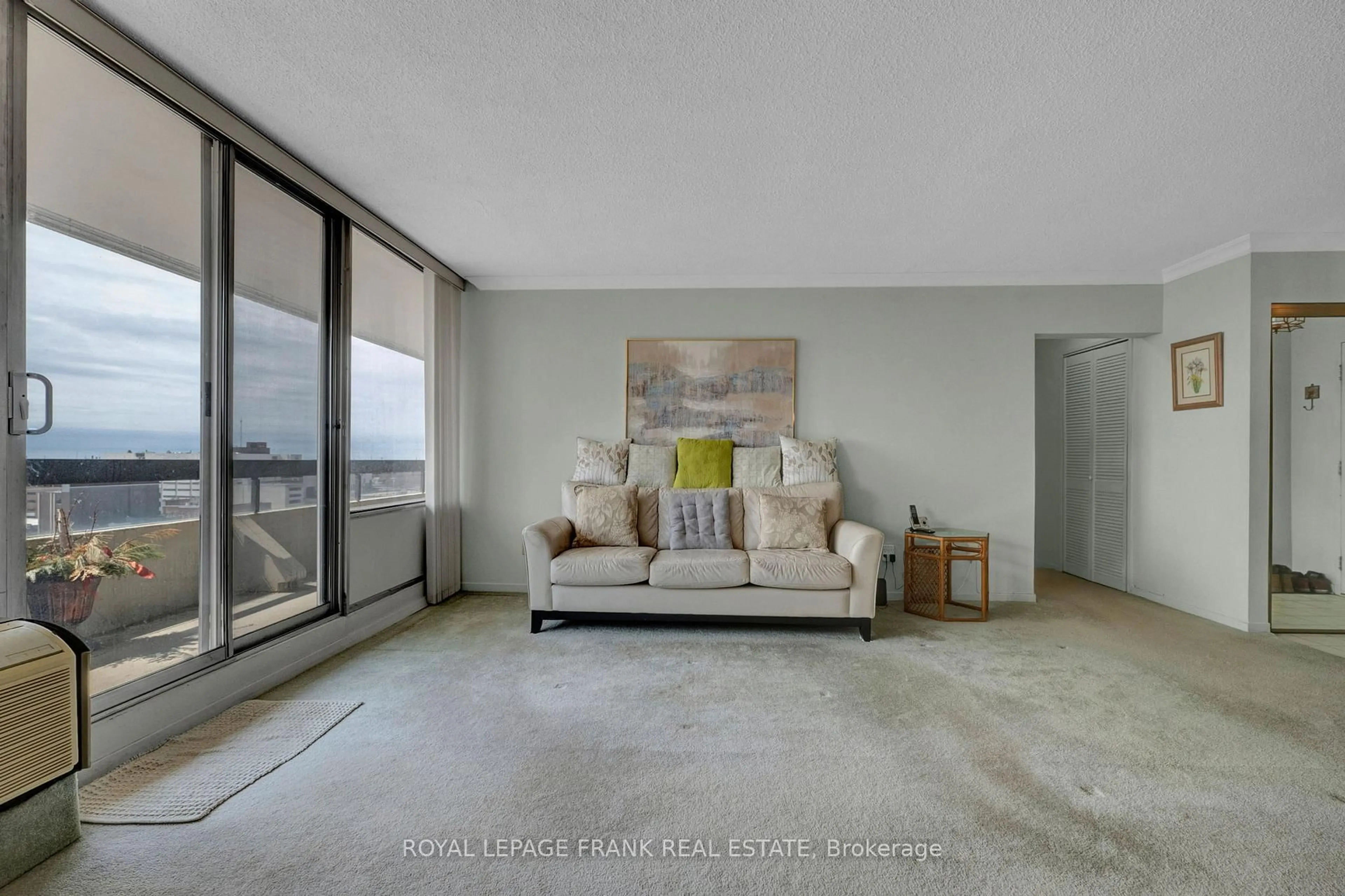 Living room with furniture, cement floor for 55 William St #1103, Oshawa Ontario L1G 7C9