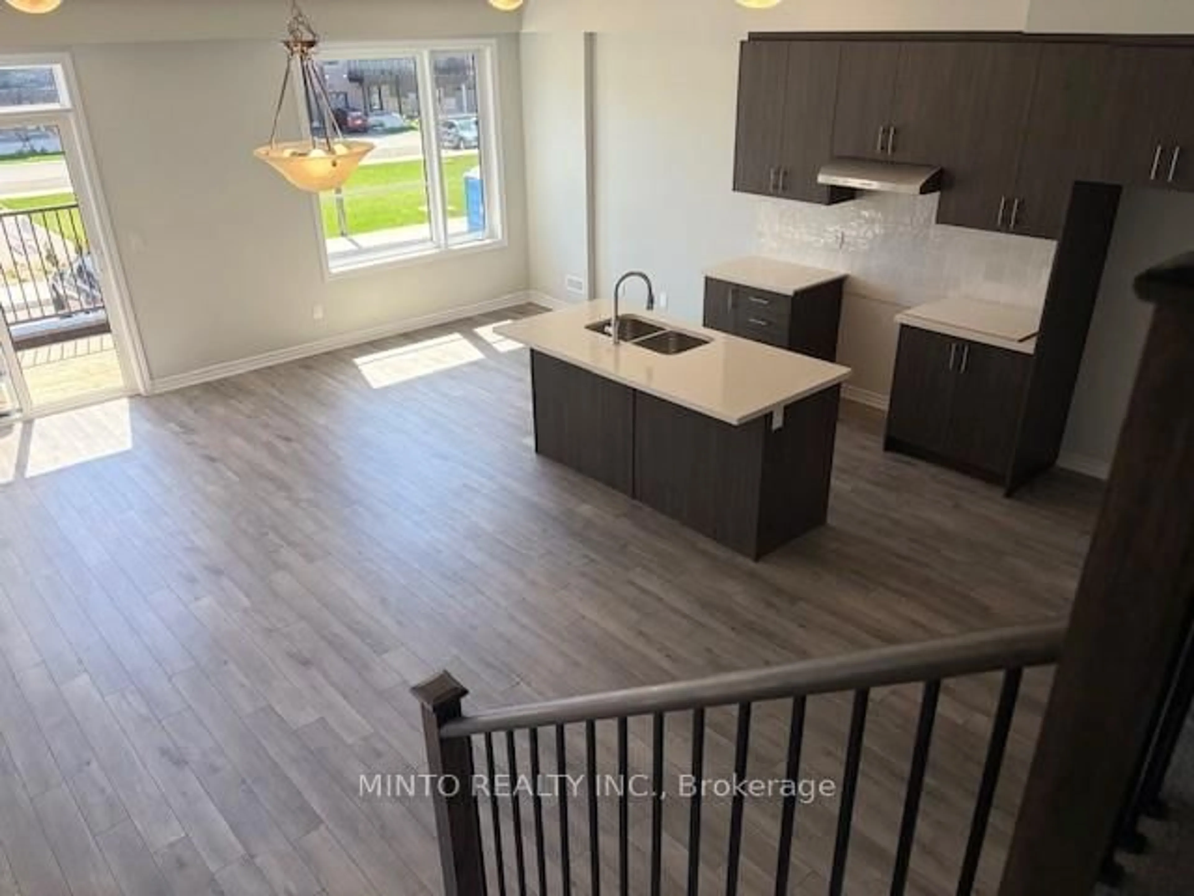 Open concept kitchen, wood/laminate floor for 1038 Porcupine Path, Oshawa Ontario L1L 0X1