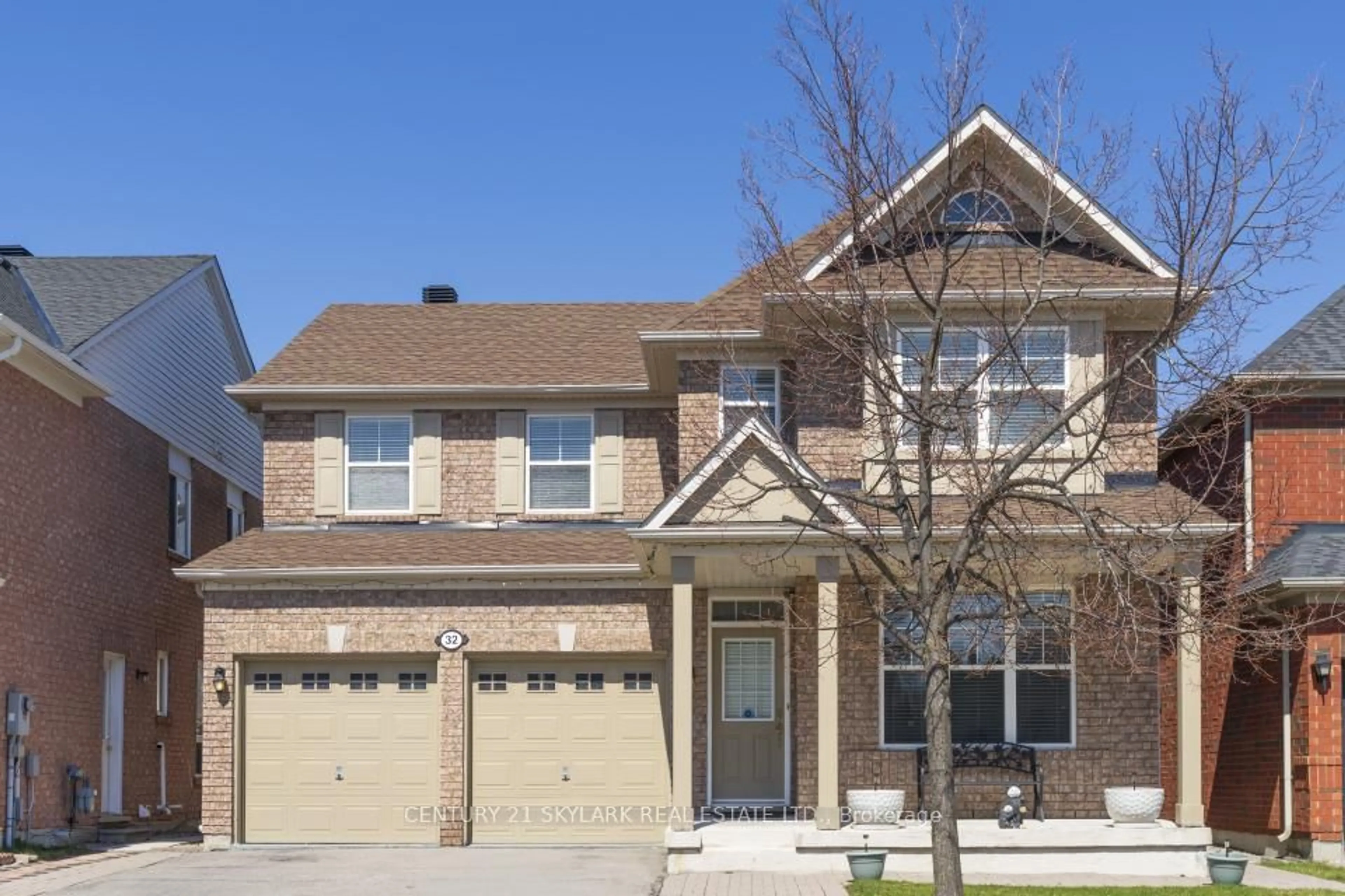 Home with brick exterior material, street for 32 Meandering Tr, Toronto Ontario M1B 6E8