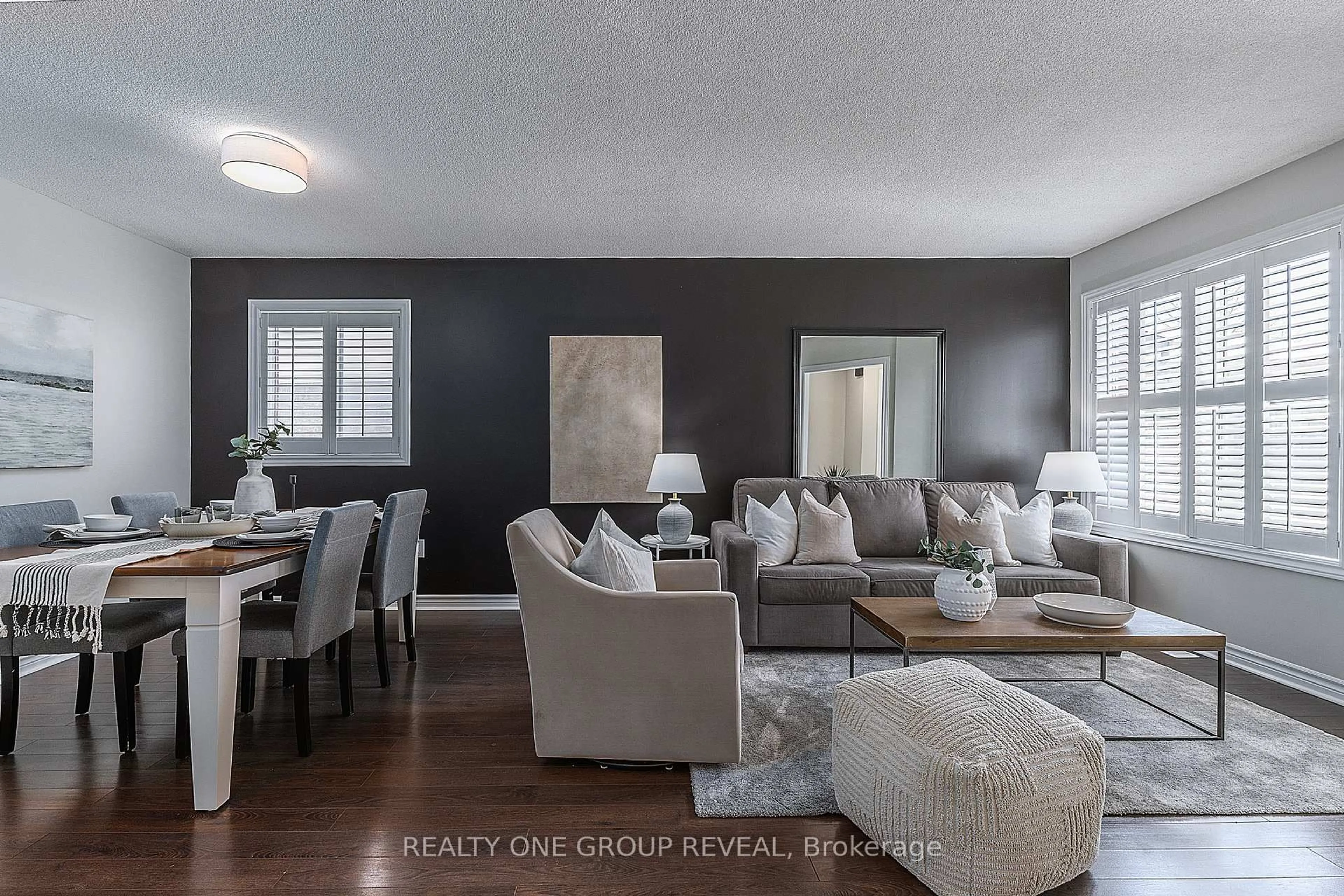 Living room with furniture, wood/laminate floor for 78 Fry Cres, Clarington Ontario L1C 4Y3