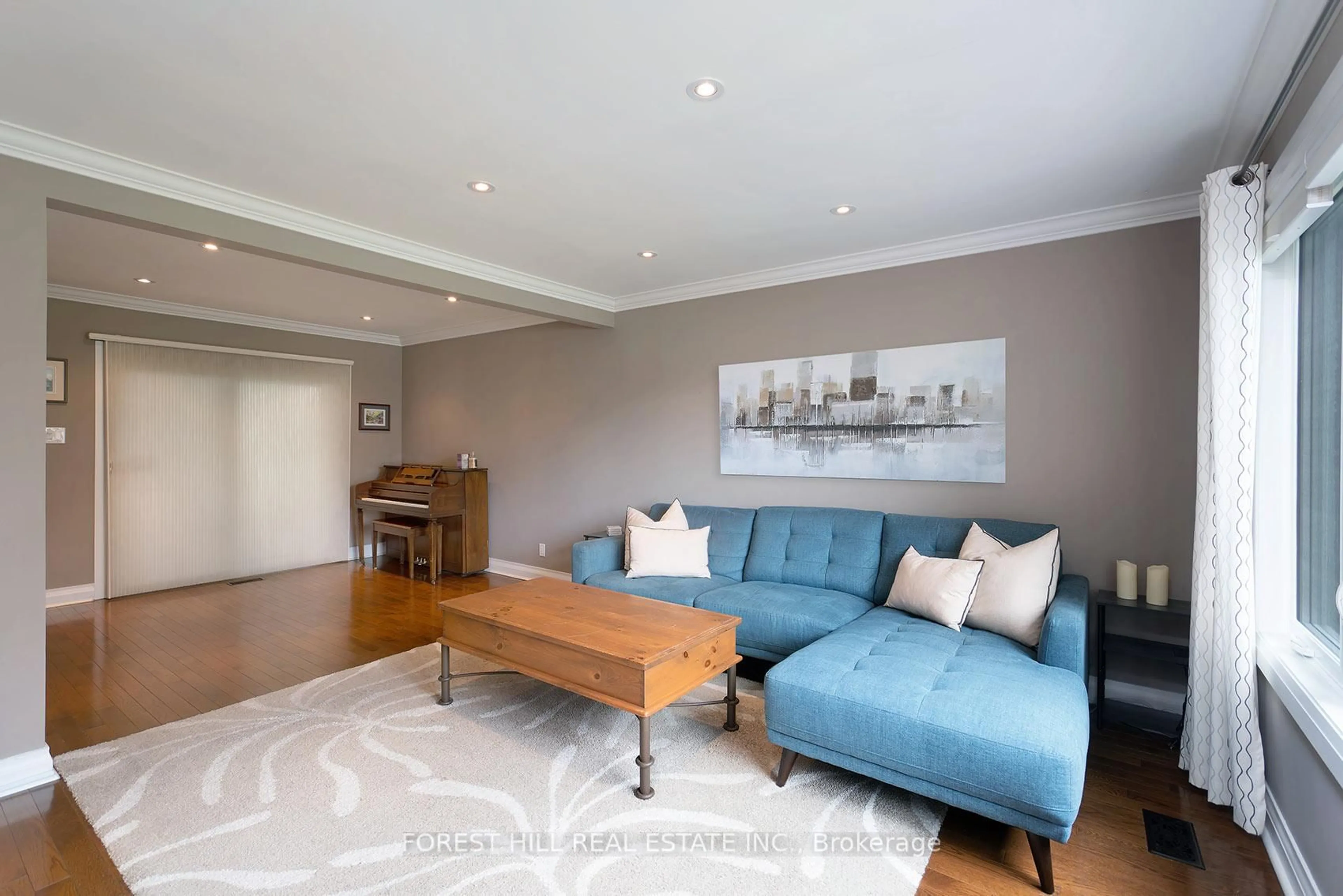 Living room with furniture, wood/laminate floor for 9 Southmead Rd, Toronto Ontario M1L 2H7