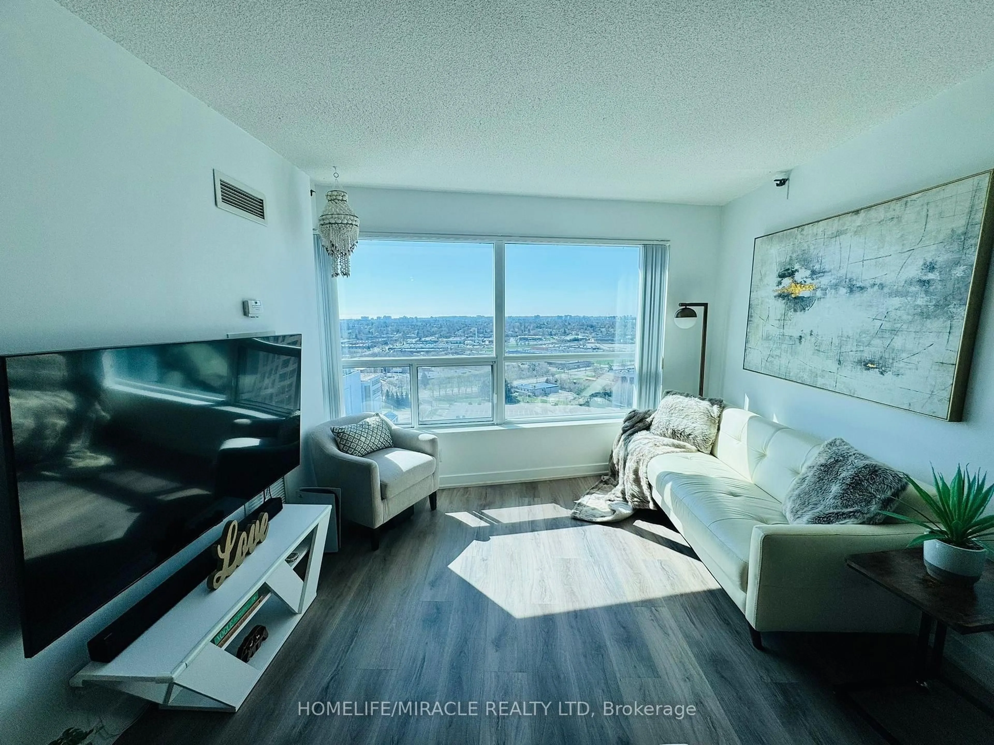 Living room with furniture, wood/laminate floor for 36 Lee Centre Dr #2106, Toronto Ontario M1H 3K2