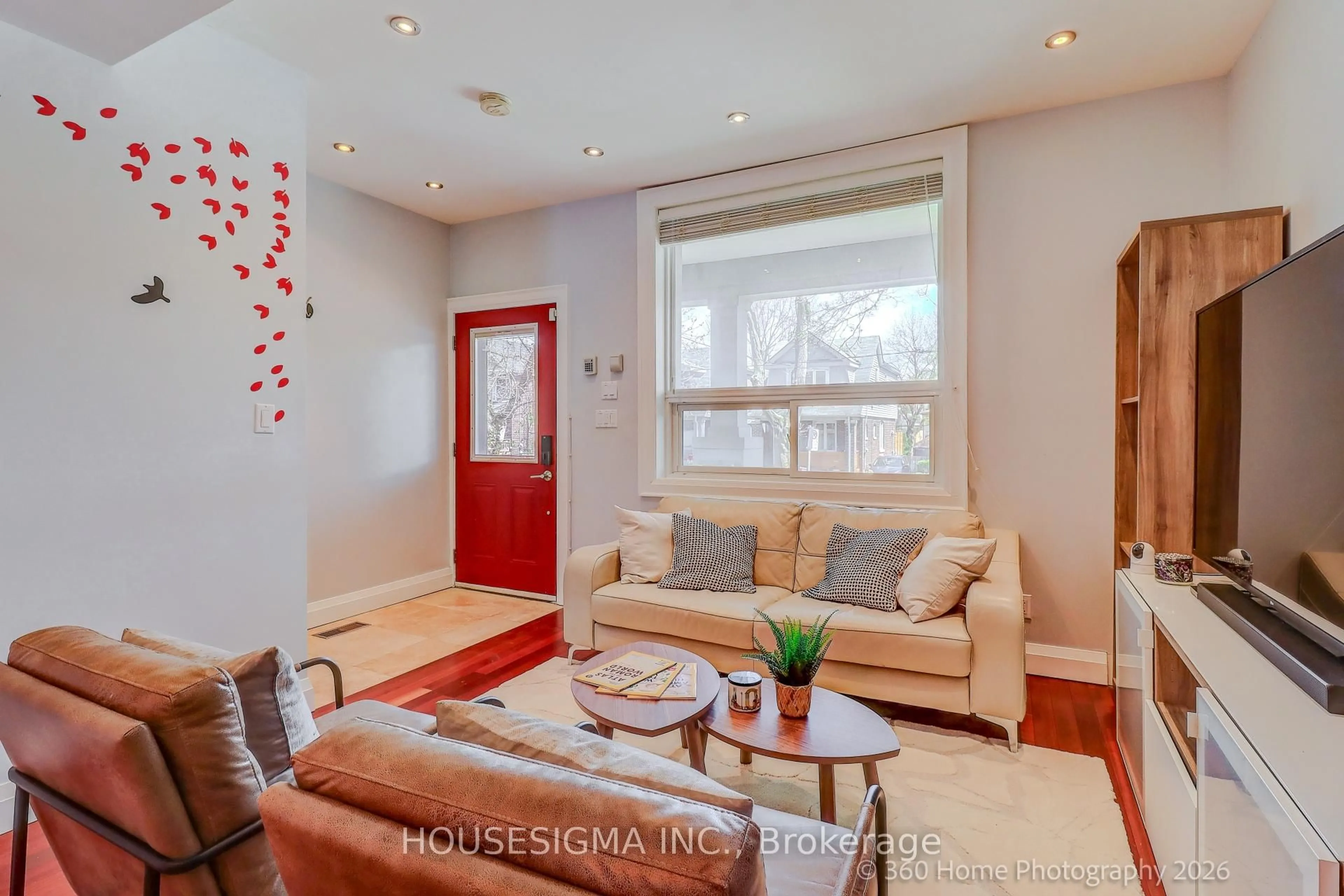 Living room with furniture, wood/laminate floor for 82 Redwood Ave, Toronto Ontario M4L 2S6