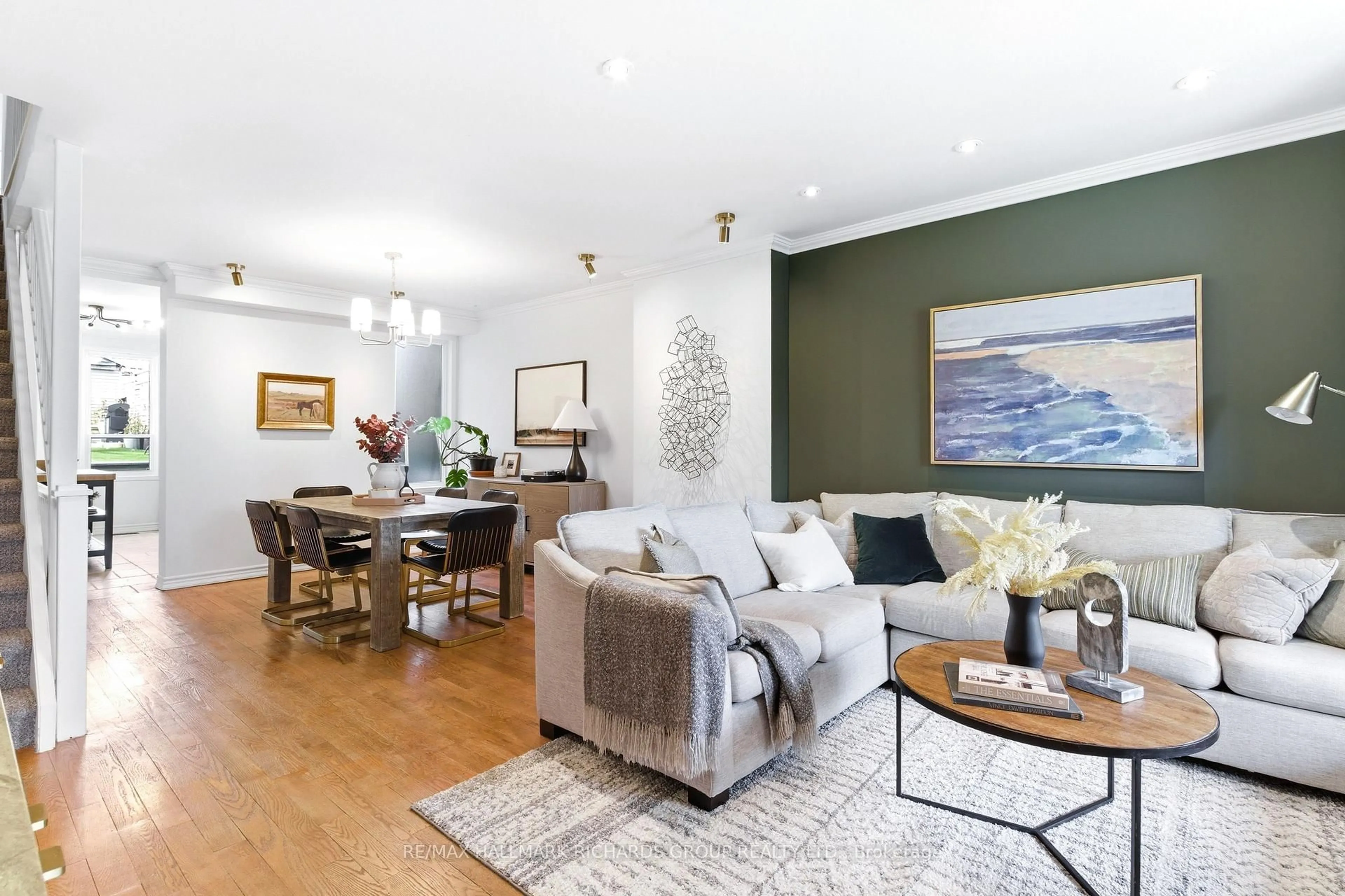 Living room with furniture, wood/laminate floor for 38 Burgess Ave, Toronto Ontario M4E 1W7