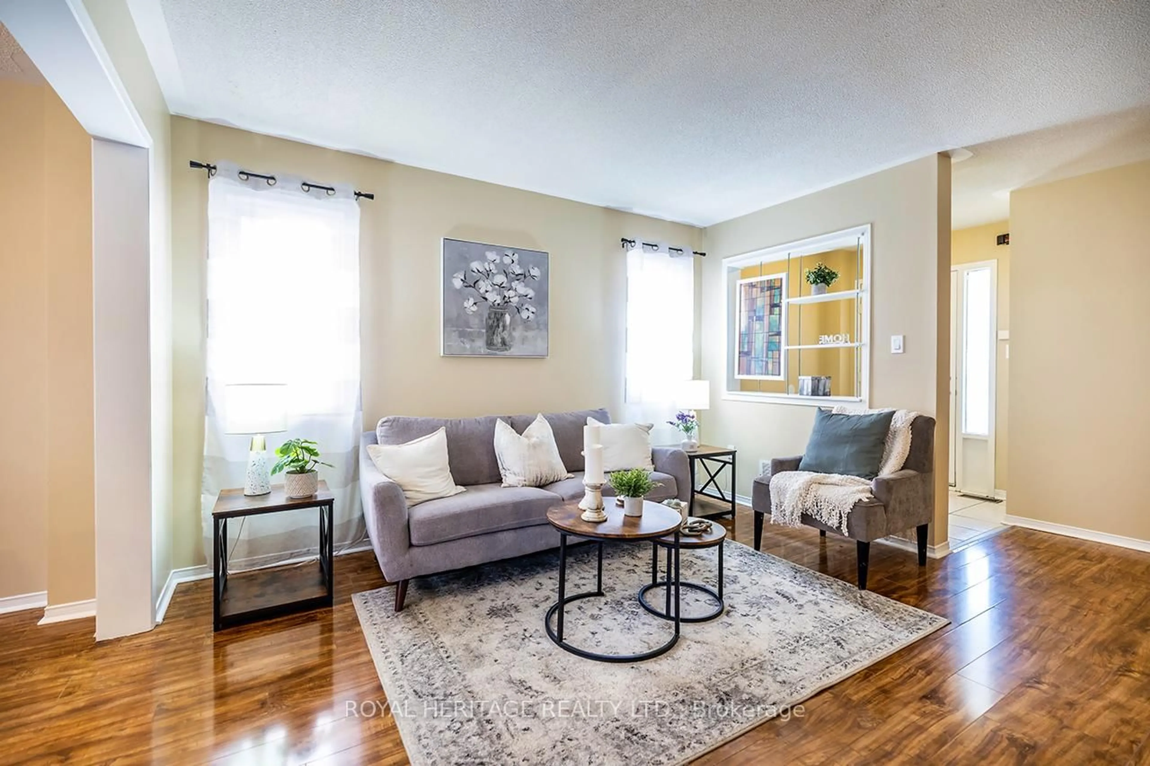 Living room with furniture, wood/laminate floor for 1834 Nordane Dr, Pickering Ontario L1V 6Z7