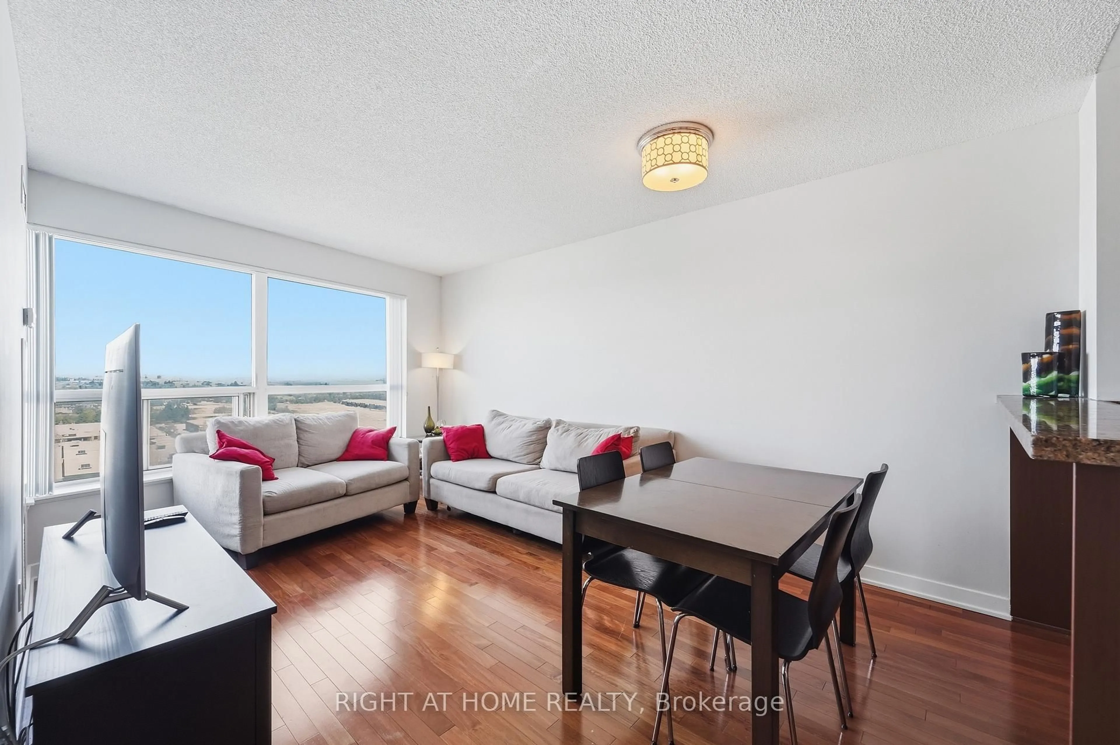 Living room with furniture, wood/laminate floor for 38 Lee Centre Dr #1612, Toronto Ontario M1H 3J7