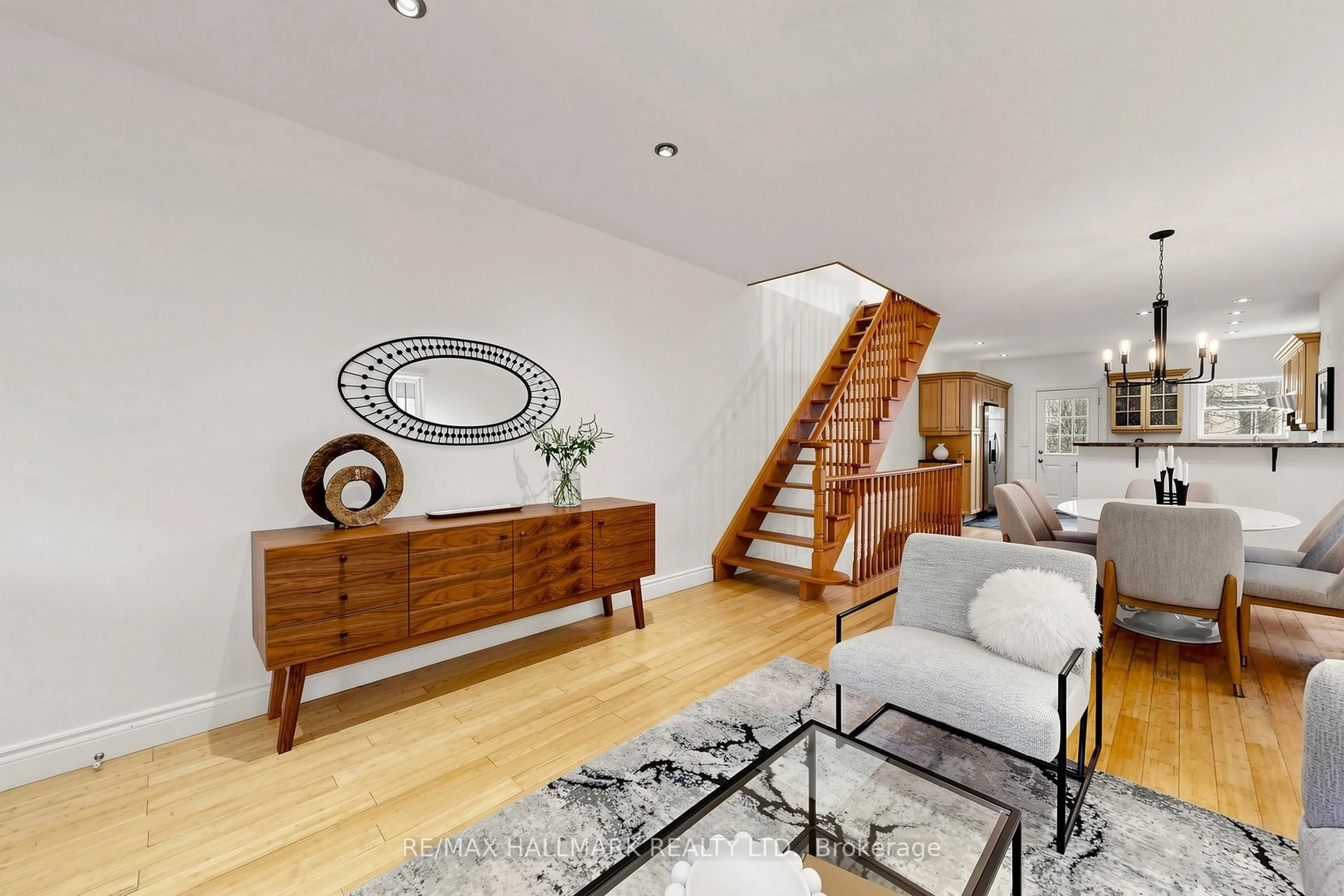 Living room with furniture, wood/laminate floor for 145 Wildwood Cres, Toronto Ontario M4L 2K9