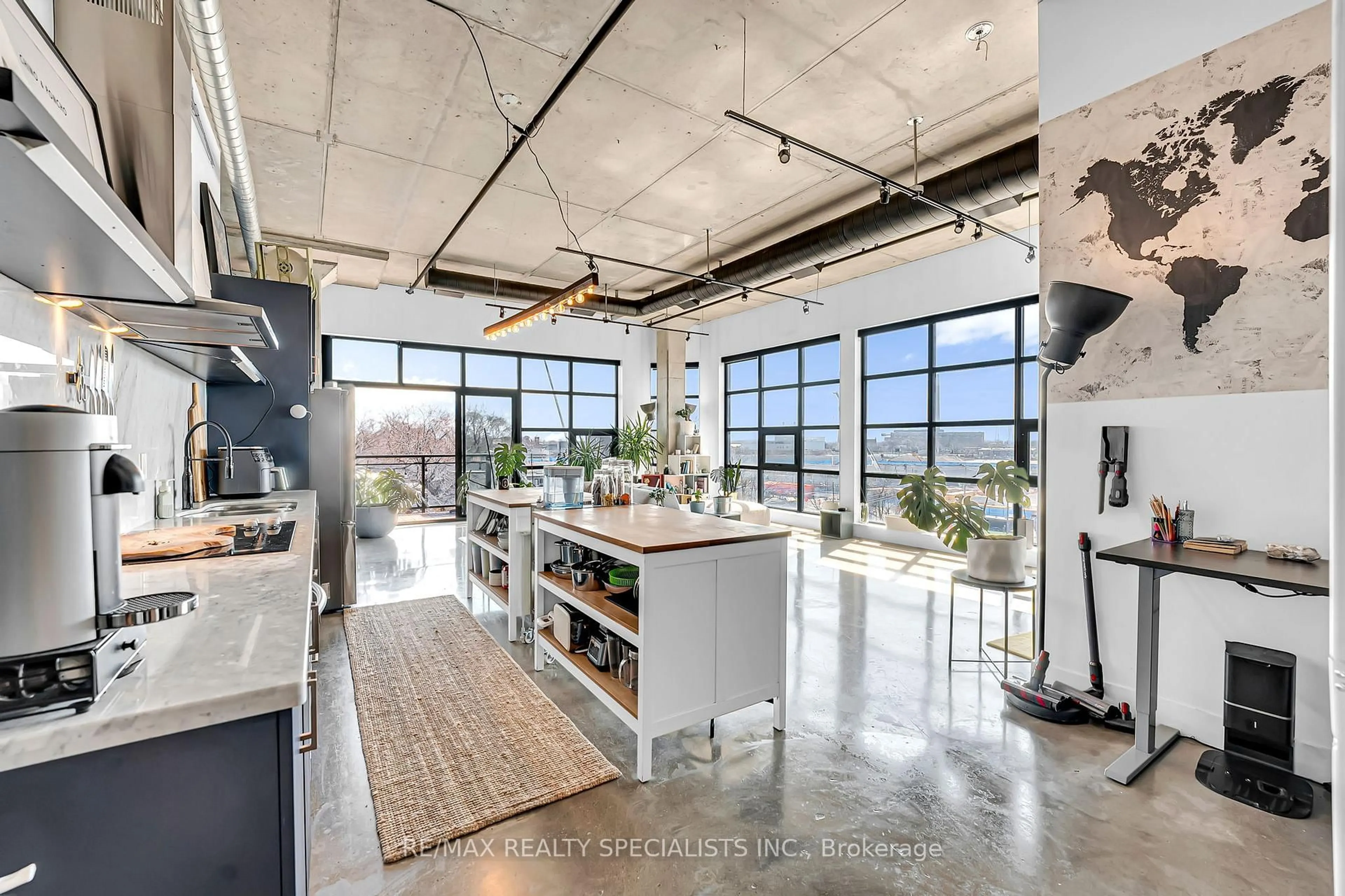 Open concept kitchen, cement floor for 68 Broadview Ave #520, Toronto Ontario M4M 2E8