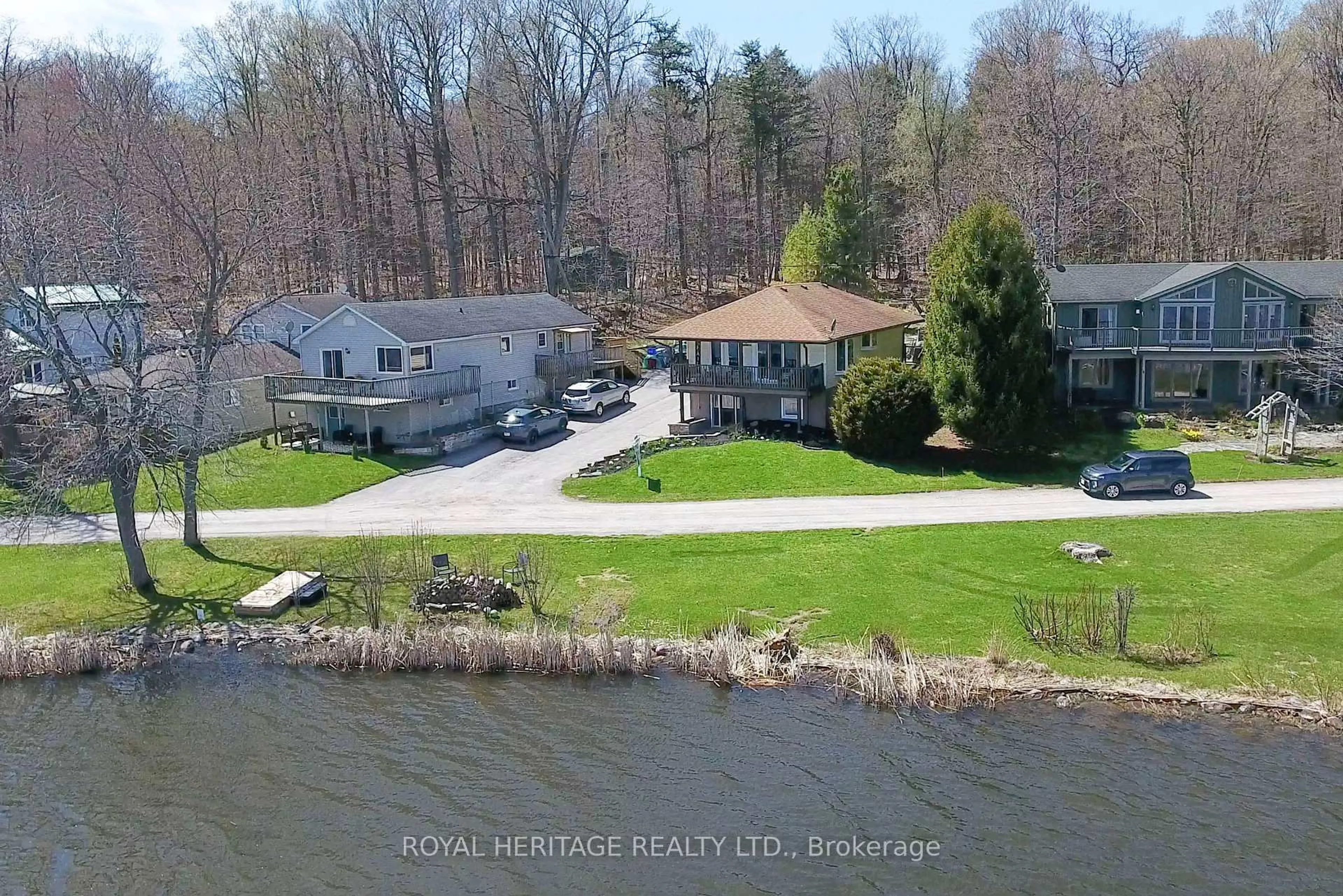 A pic from outside/outdoor area/front of a property/back of a property/a pic from drone, water/lake/river/ocean view for 56 Pine Point Lane, Scugog Ontario L9L 1B4