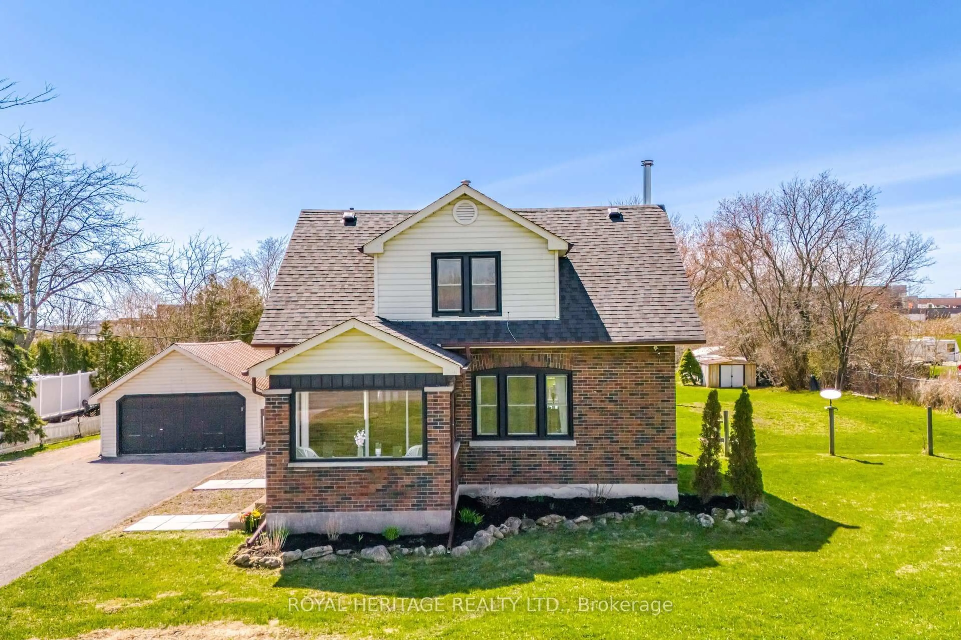 Home with brick exterior material, street for 2203 Highway #2, Clarington Ontario L1C 6E6