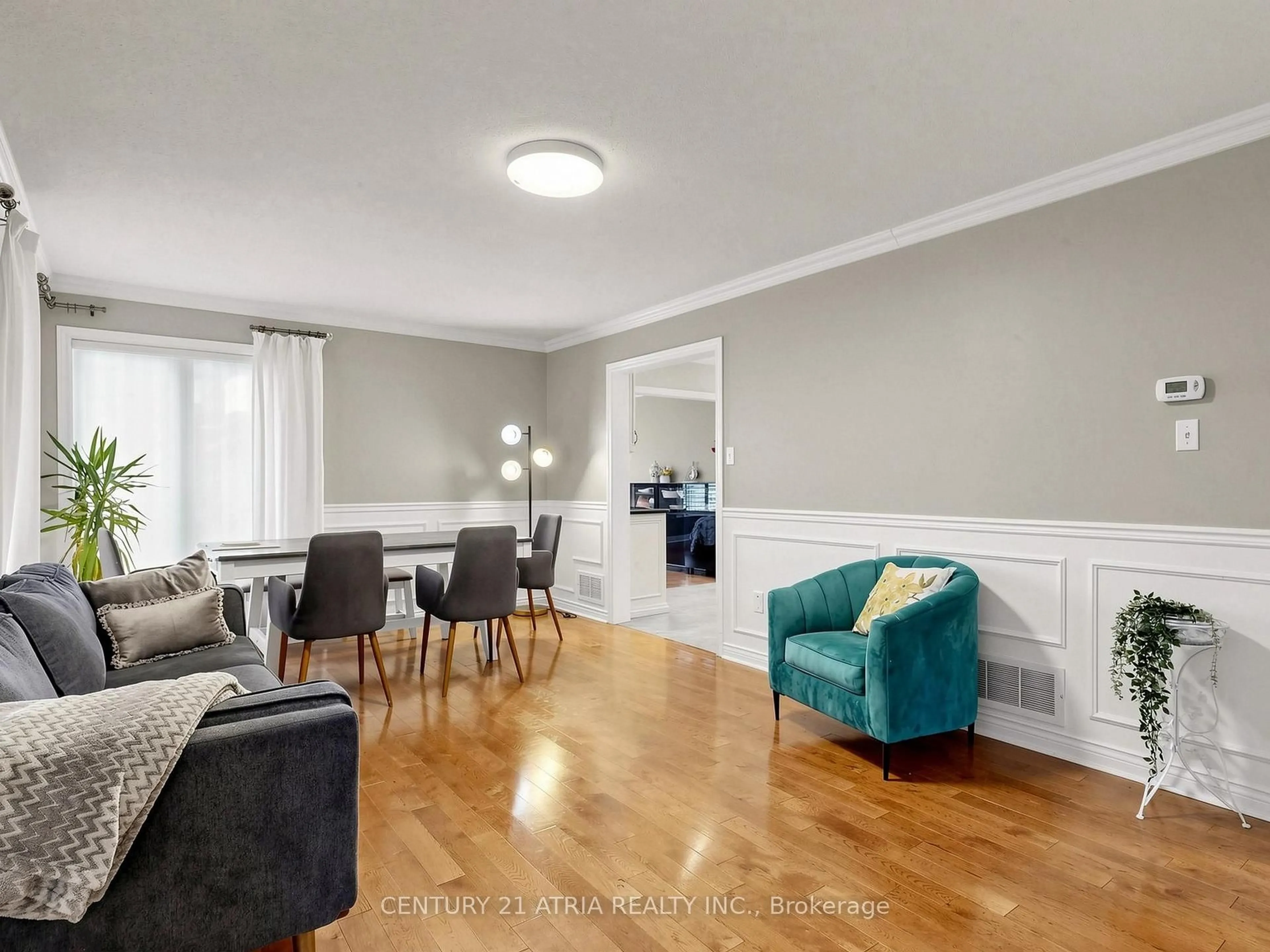 Living room with furniture, wood/laminate floor for 14 Robert Attersley Dr, Whitby Ontario L1R 3E3