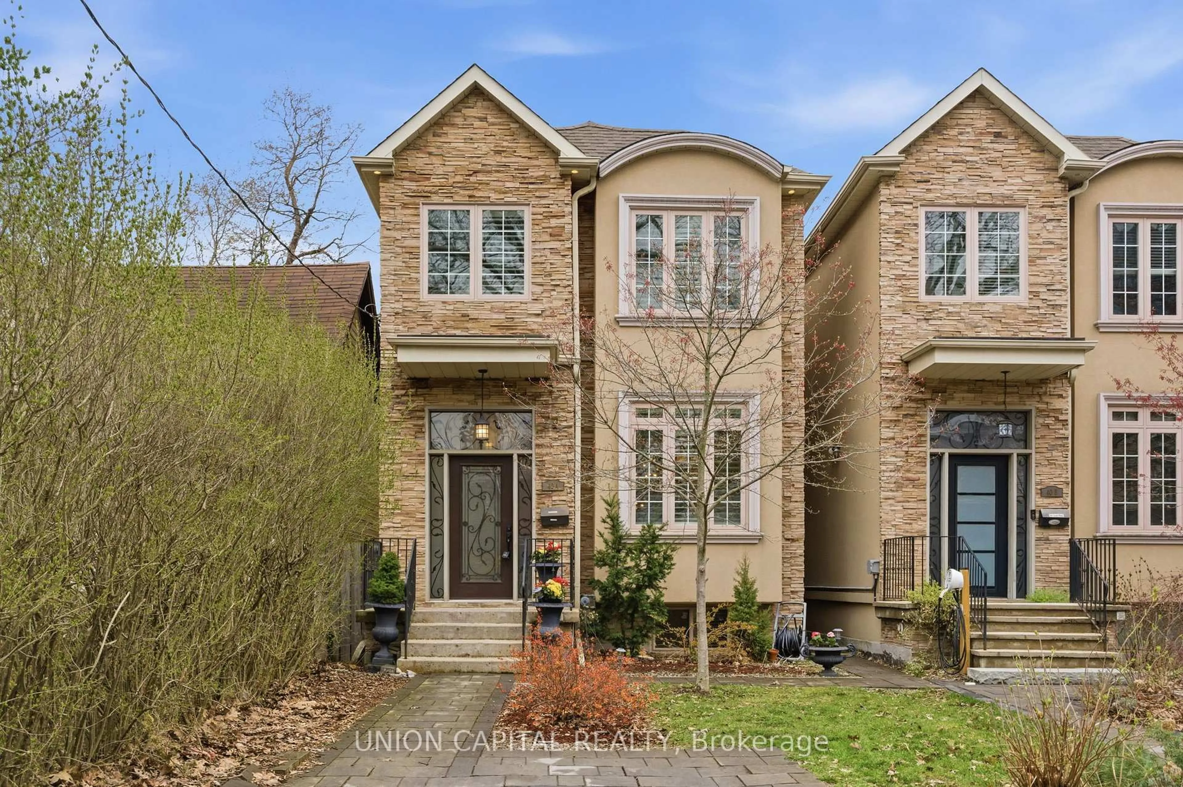 Home with brick exterior material, street for 40A Norwood Rd, Toronto Ontario M4E 2S2