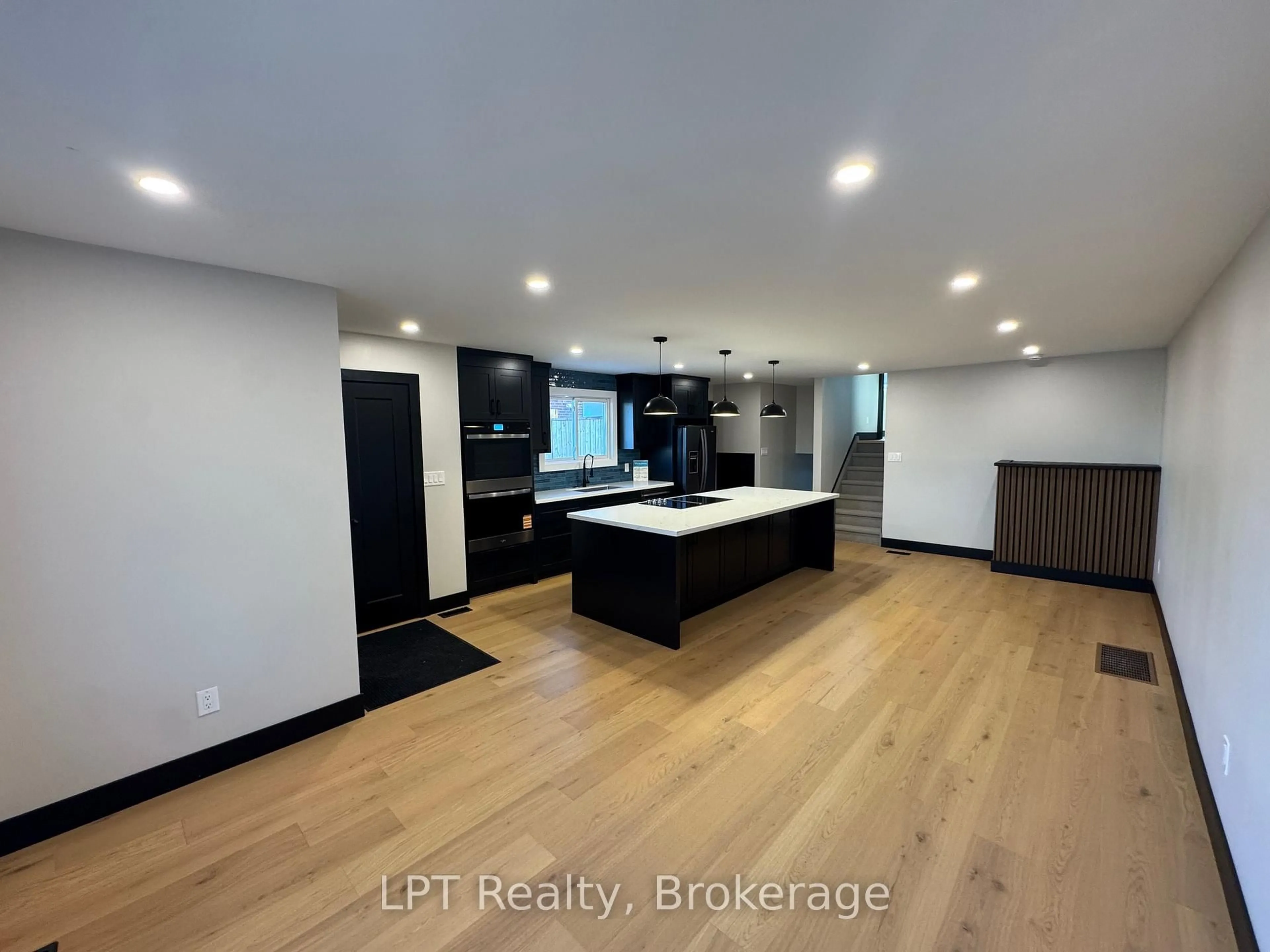 Open concept kitchen, wood/laminate floor for 1281 Oxford St, Oshawa Ontario L1J 3W5
