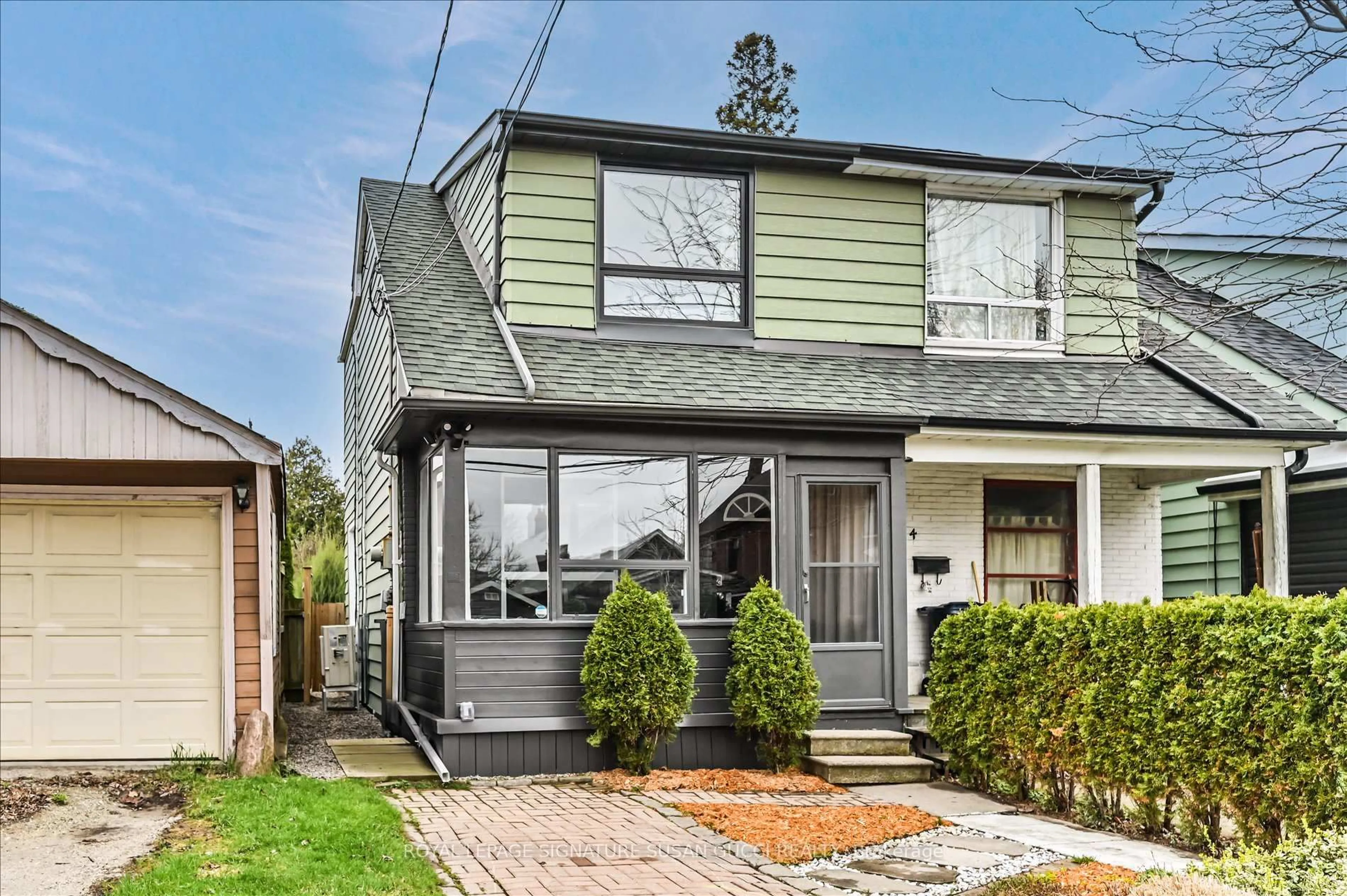 Home with vinyl exterior material, street for 2 Newman Ave, Toronto Ontario M4C 5A4