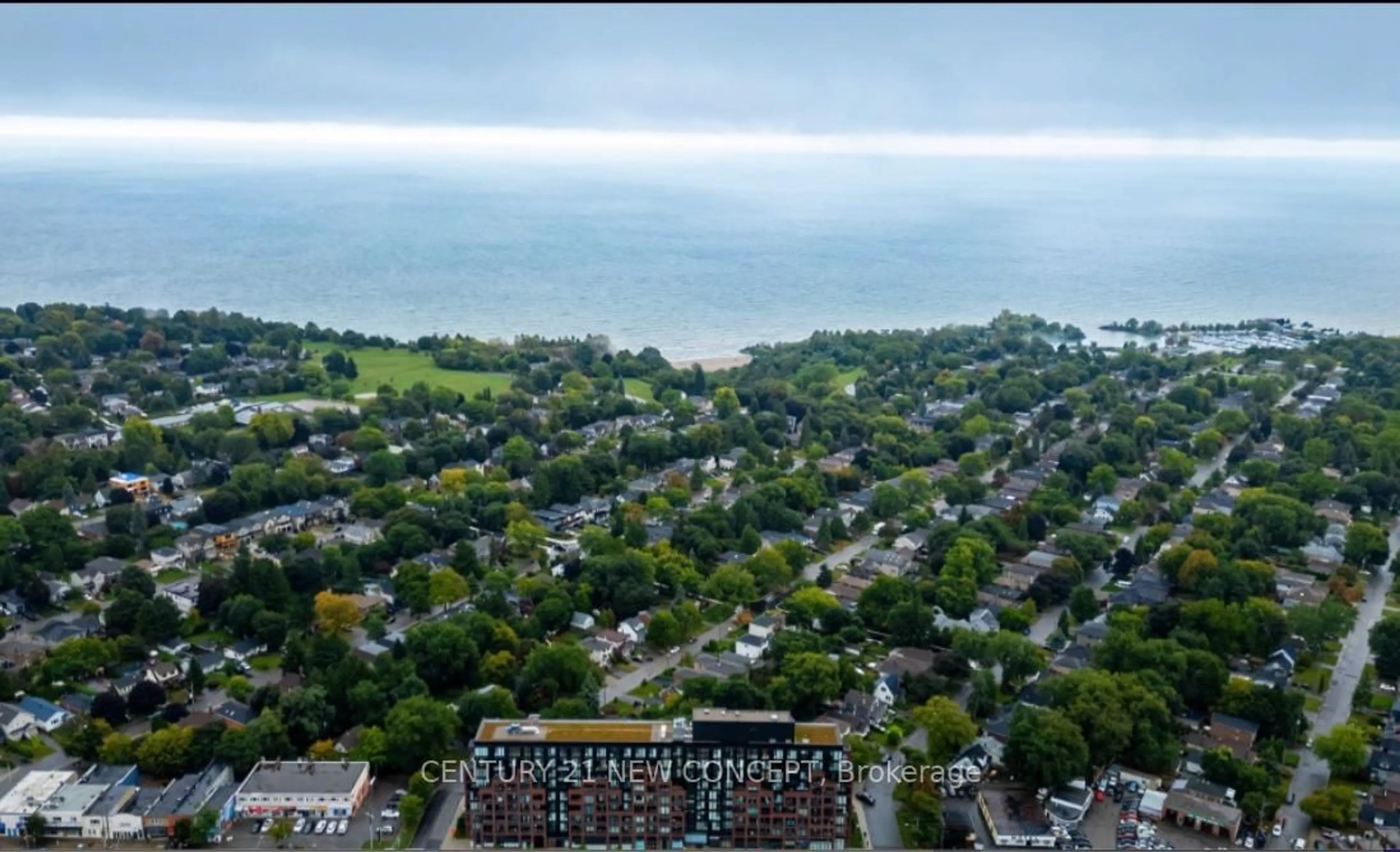 A pic from outside/outdoor area/front of a property/back of a property/a pic from drone, water/lake/river/ocean view for 2799 Kingston Rd #301, Toronto Ontario M1M 0E3