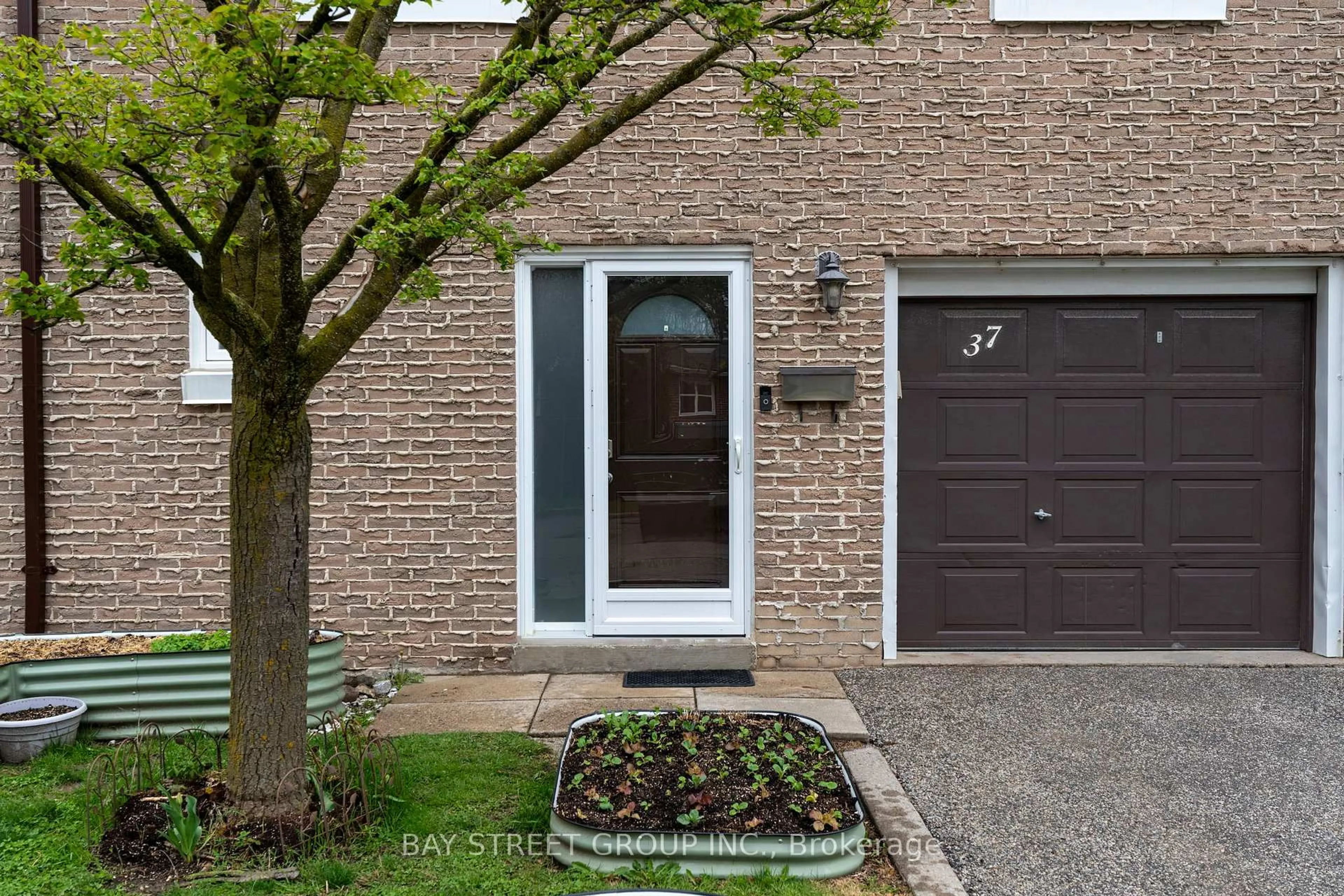 Home with brick exterior material, street for 671 Huntingwood Dr #37, Toronto Ontario M1W 1H6