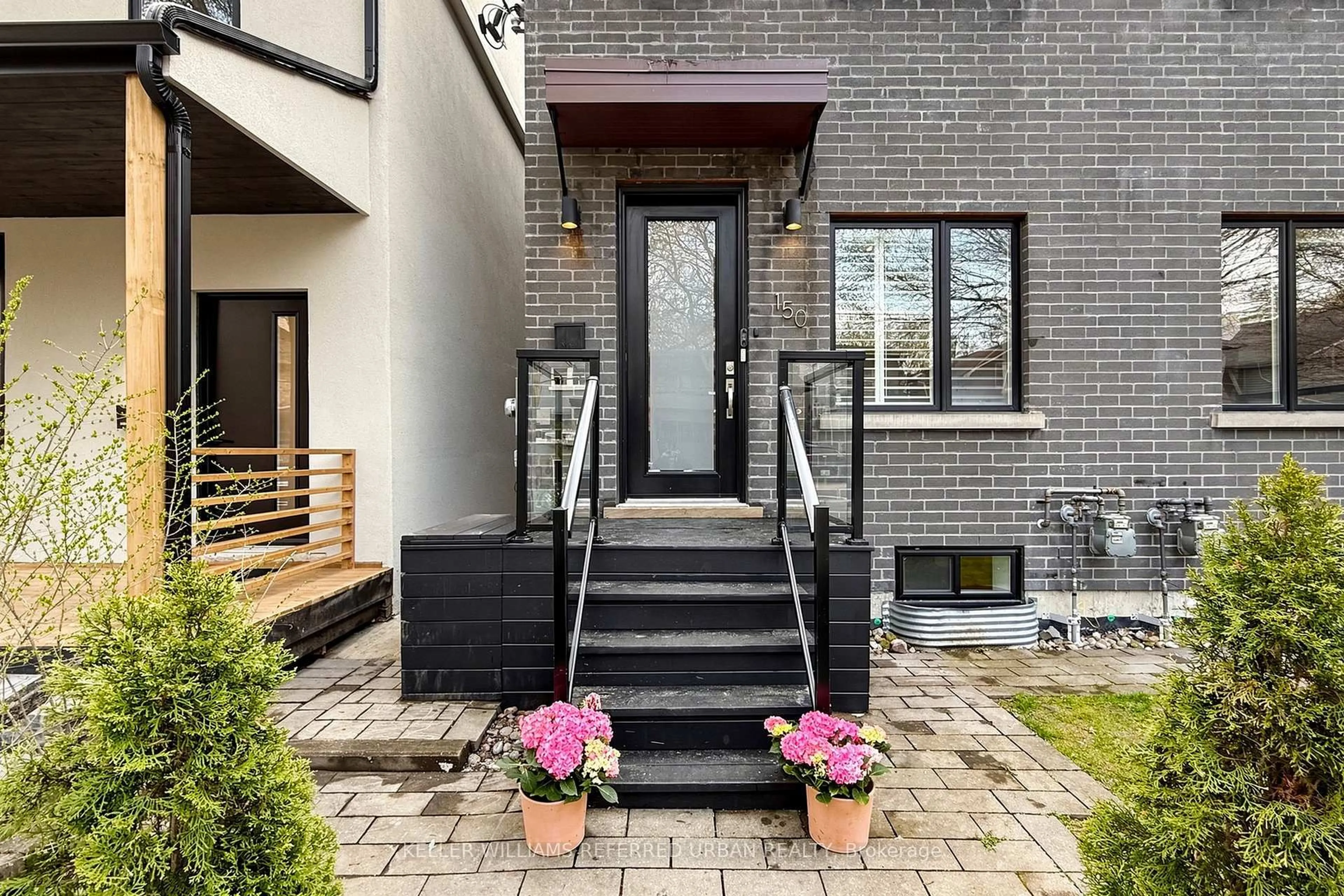 Home with brick exterior material, street for 150 Rhodes Ave, Toronto Ontario M4L 3A1